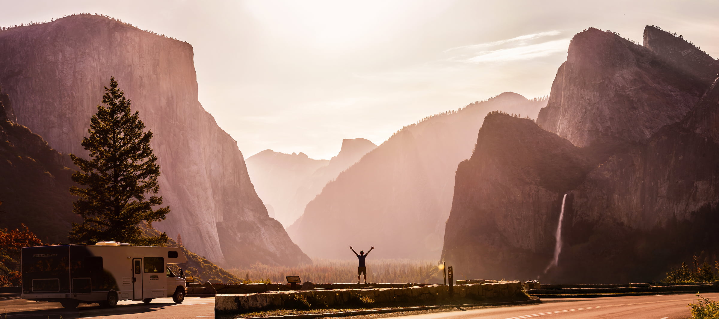 138 megapixels! A very high definition inspirational VAST photo of a joyful man in nature among mountains and waterfalls; created by Dan Piech in the valley of Yosemite National Park.