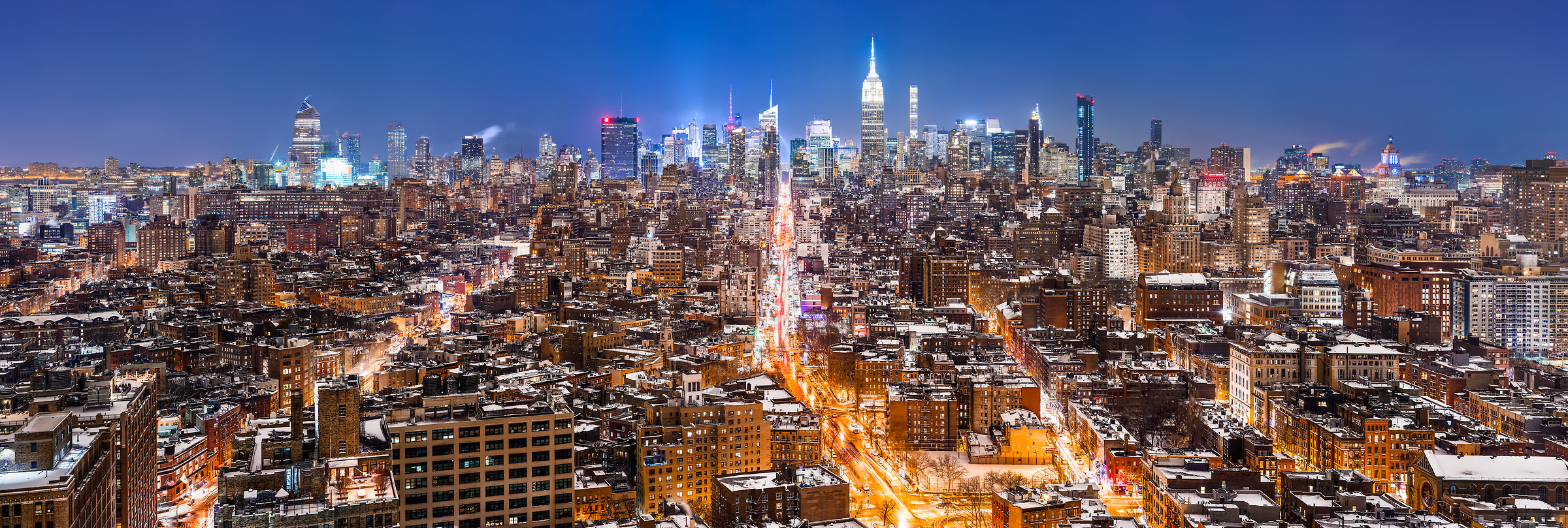 A very high resolution, large-format VAST photo print of the NYC skyline in winter snow at night; cityscape fine art photo created by Dan Piech in New York City