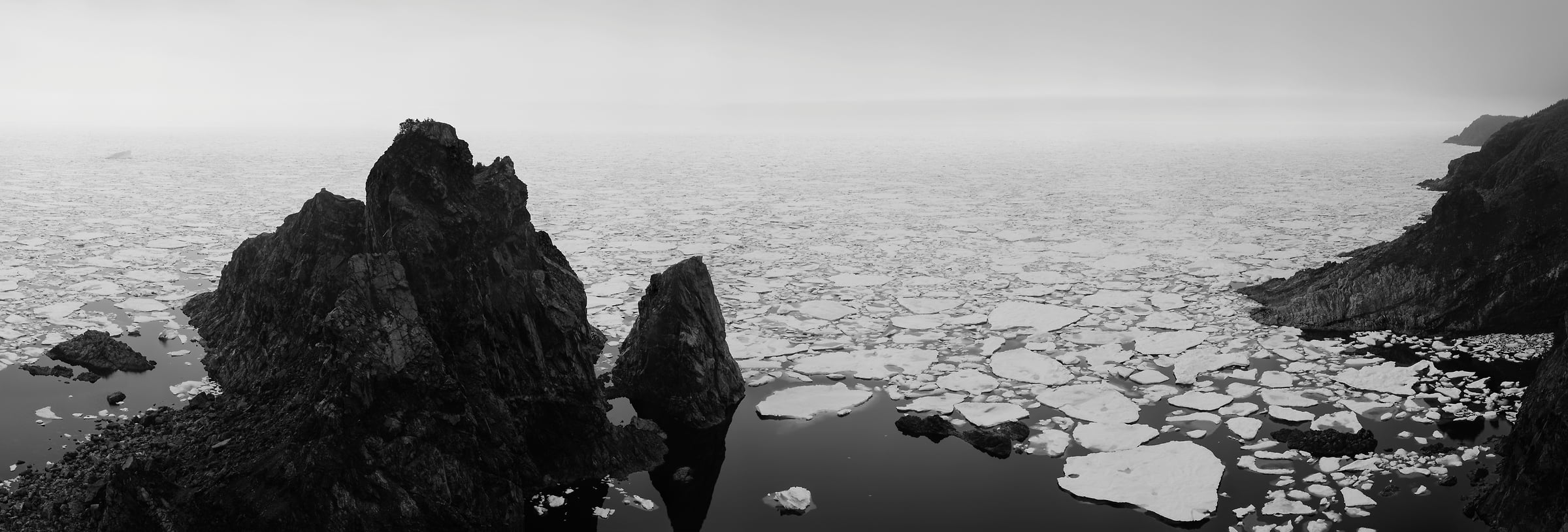 1,580 megapixels! A very high resolution, large-format VAST photo of ice and icebergs floating in an ocean bay; black & white fine art landscape photo created by Scott Dimond in La Scie, Newfoundland, Canada.