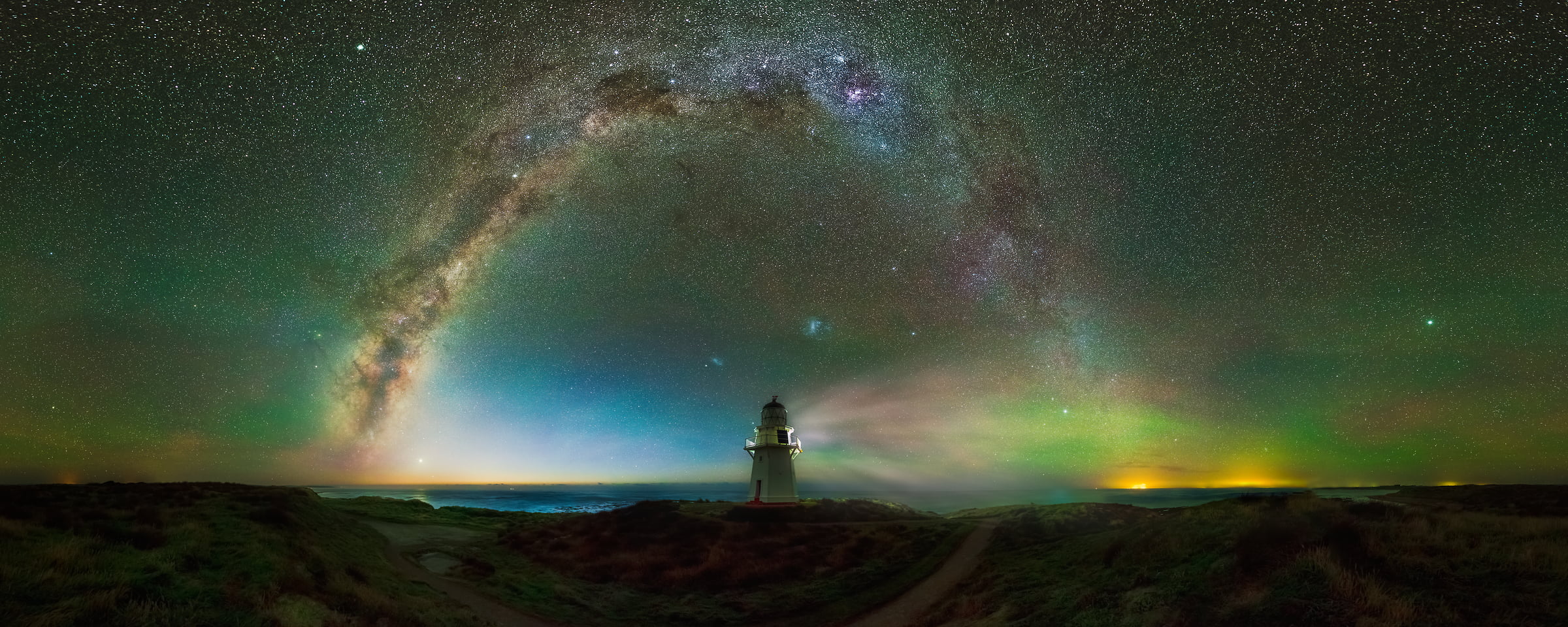 160 megapixels! A very high resolution, large-format VAST photo print of the night sky, milky way, and stars over a lighthouse; fine art astrophotography landscape photo created by Paul Wilson in Waipapa Point Lighthouse, Southland, New Zealand.