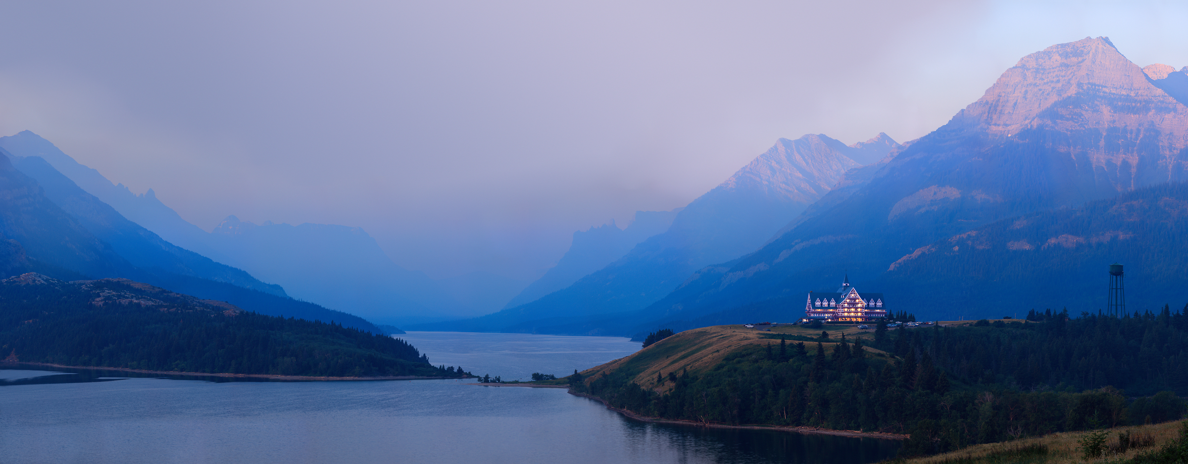 4,650 megapixels! A very high resolution, large-format VAST photo print of the Prince of Wales Hotel in Waterton Lakes National Park with smoke from a wildfire in the valley in the background; fine art landscape photograph created by Scott Dimond in Alberta, Canada.