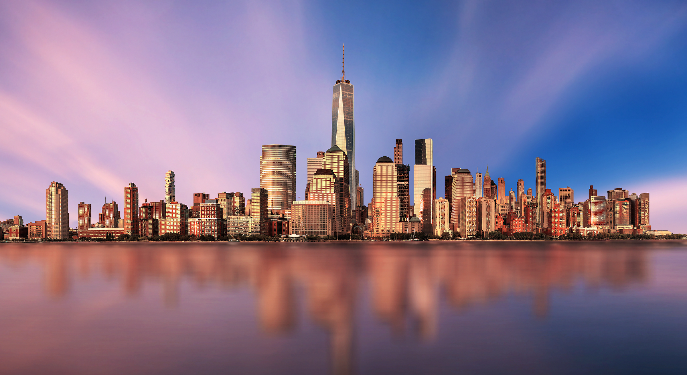 4,201 megapixels! An incredibly high resolution photo of a beautiful sunset, the NYC skyline, and the World Trade Center; cityscape fine art print created by Chris Collacott in Manhattan, New York City.