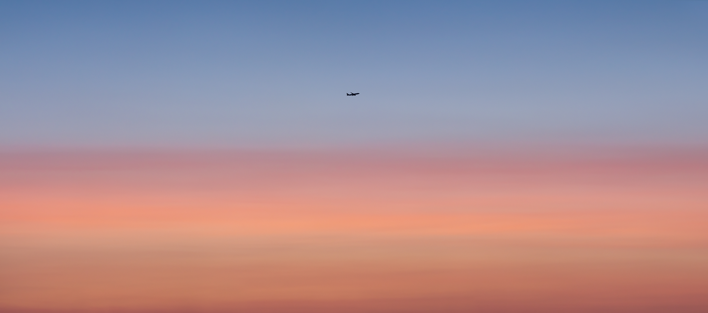 452 megapixels! A very high resolution, large-format VAST photo of an airplane taking off or landing in a vibrant, pastel, colorful sunset; fine art airplane photograph created by Dan Piech in New York City.