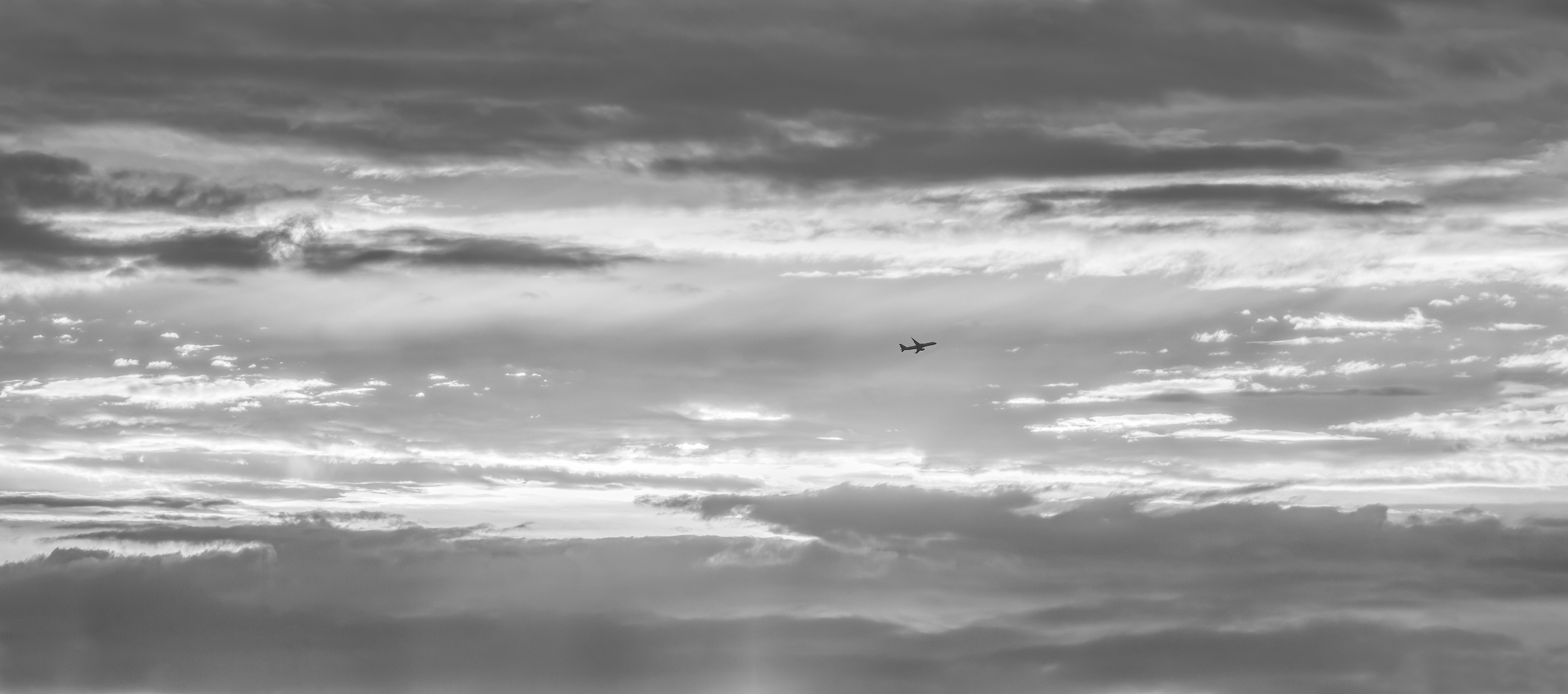 328 megapixels! A very high resolution, black & white VAST photo print of a plane with a sunset behind it; fine art photograph created by Dan Piech in New York City.