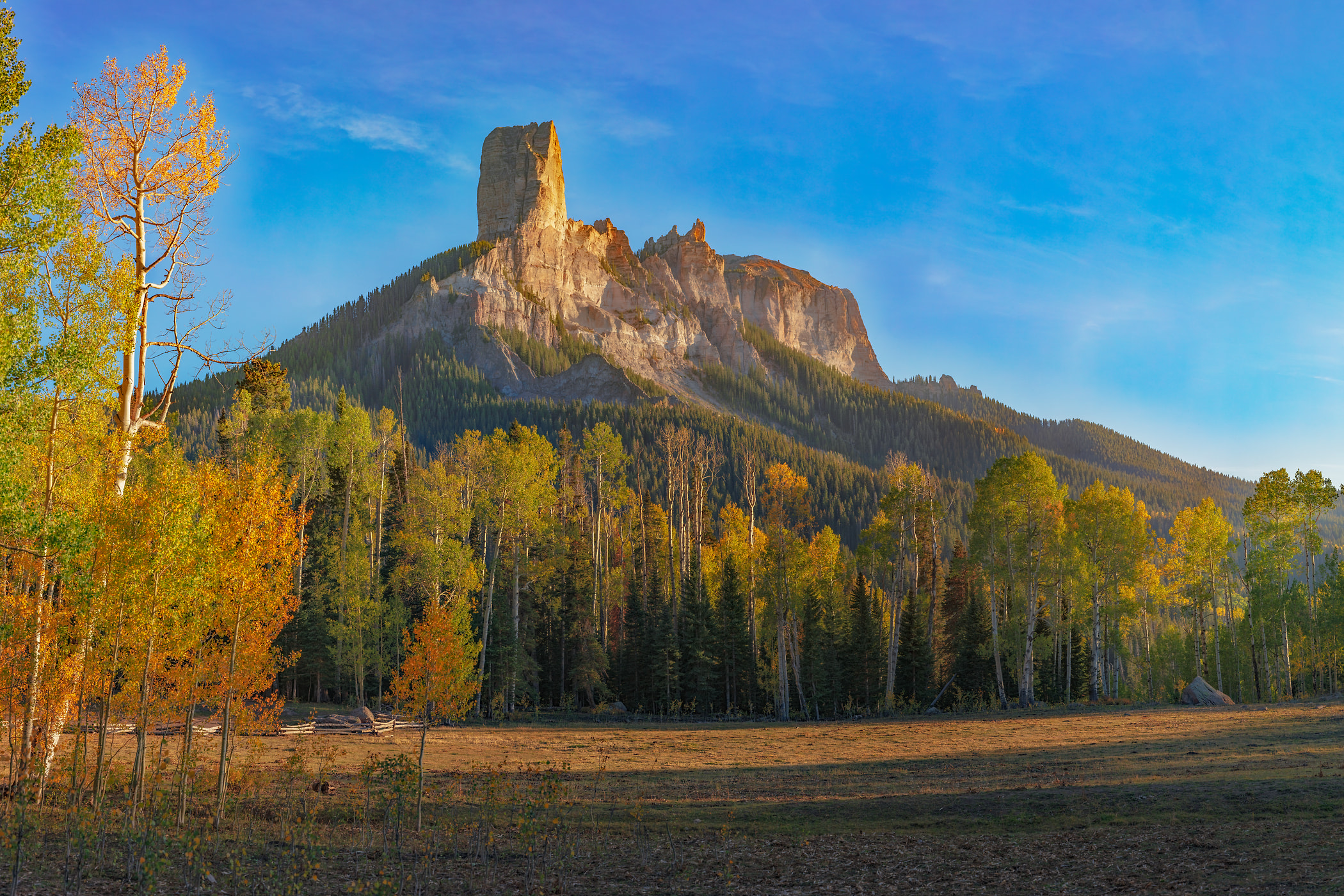 1,015 megapixels! A very high resolution, wall art photo of a mountain at sunset with autumn trees in the foreground; landscape photograph created by John Freeman in Deb's Meadow,  Cimarron Ridge, San Juan Mountains, Colorado.