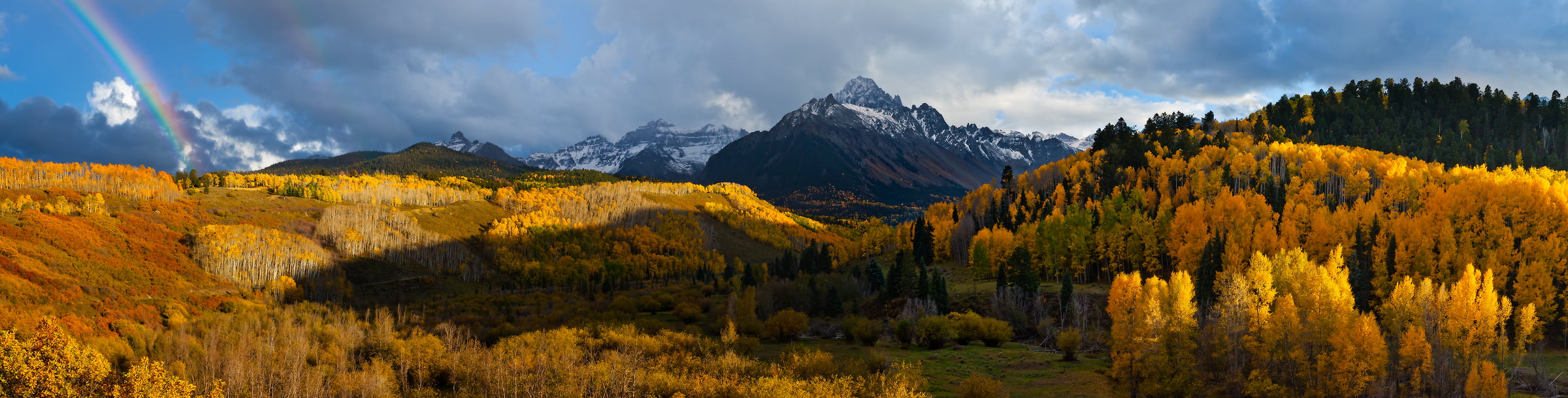 108 megapixels! A very high resolution, large-format VAST photo print of an autumn landscape with forests, mountains, and a rainbow; photograph created by Phillip Noll in Ridgway, Colorado.