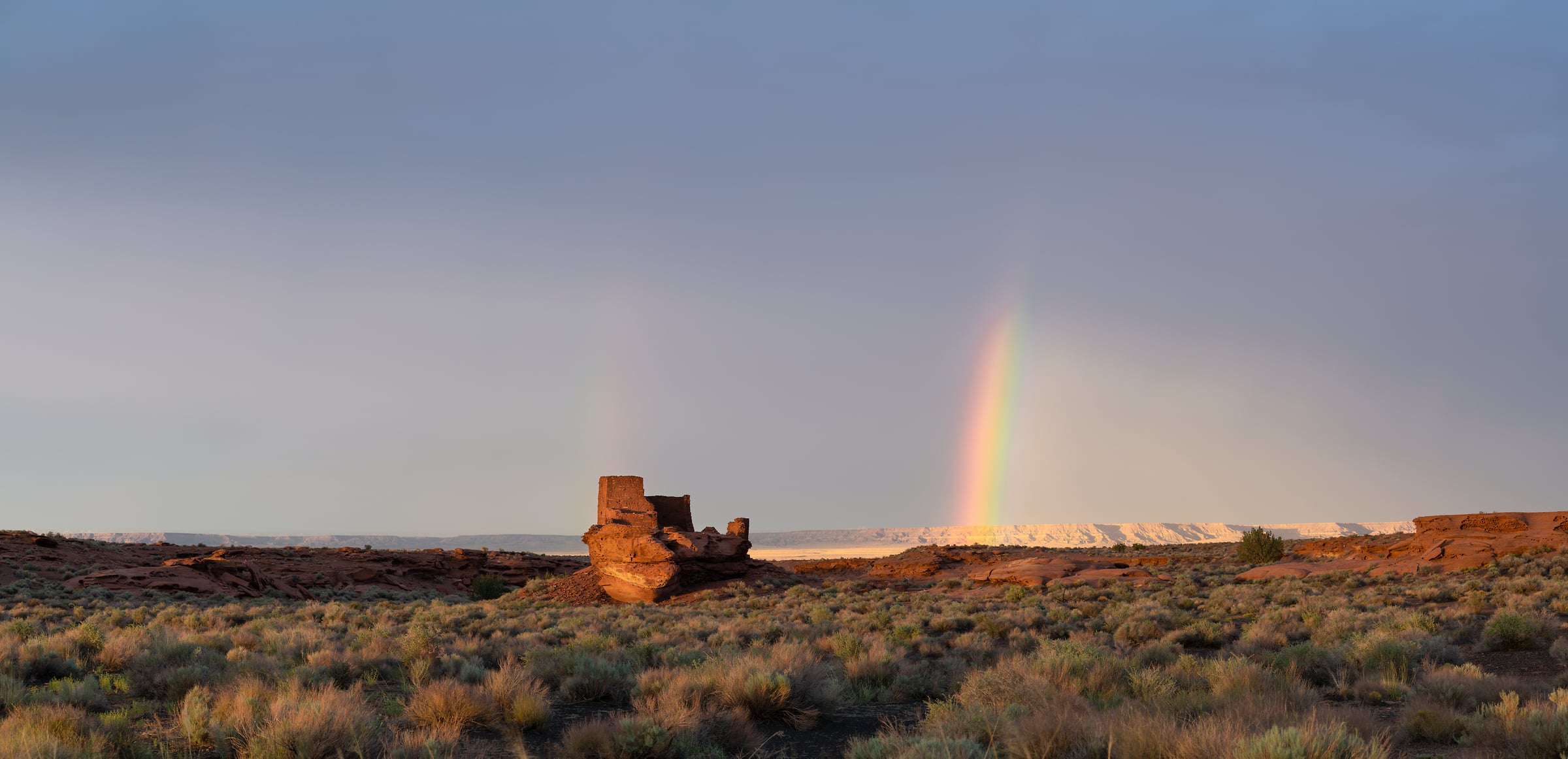 263 megapixels! A very high resolution, large-format VAST photo print of Wukoki Pueblo in Wupatki National Monument with a rainbow; landscape photograph created by Greg Probst in Wupatki National Monument, Arizona.