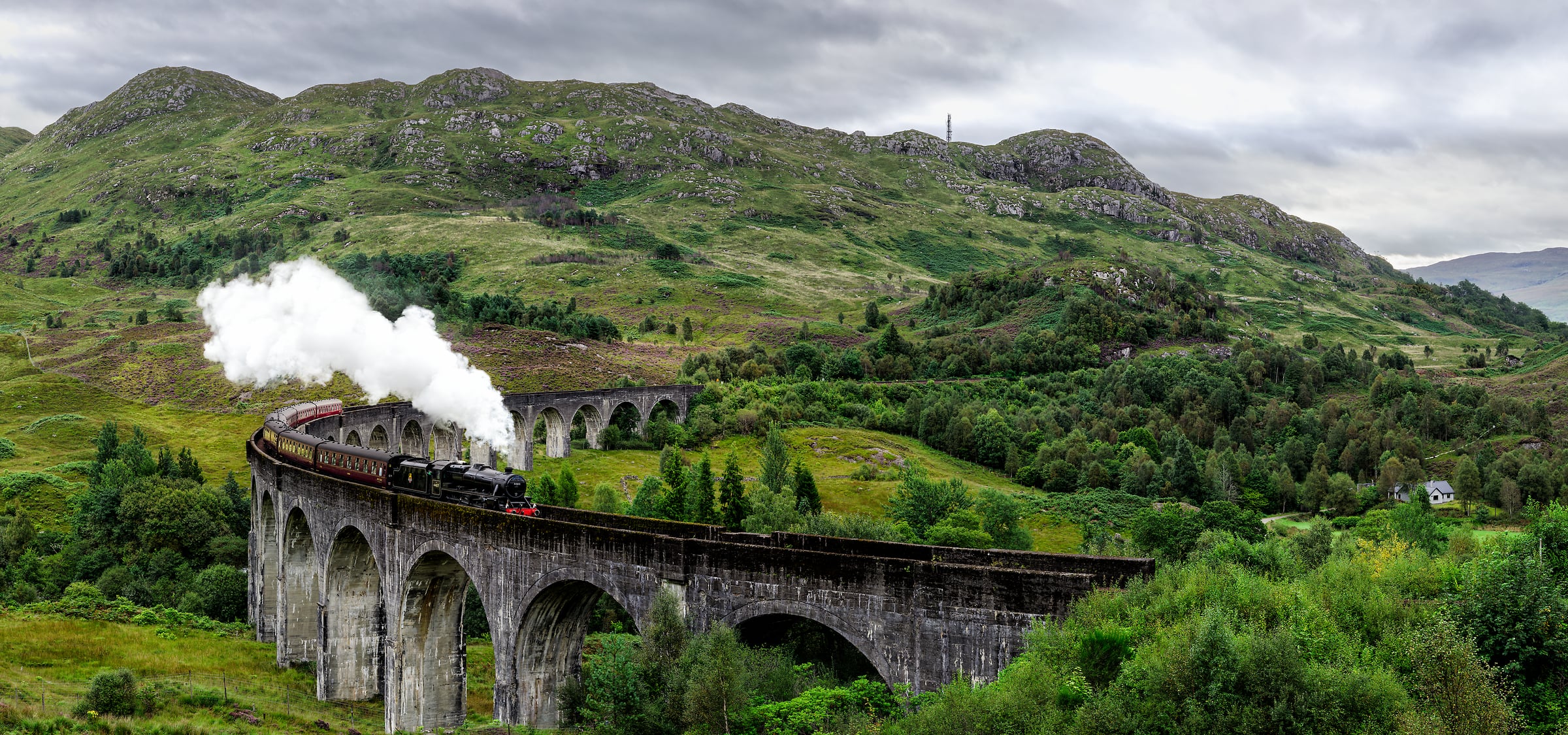 936 megapixels! A very high resolution, large-format VAST photo print of the Jacobite railroad train steam locomotive going across the Glenfinnan Viaduct railroad bridge; photograph created by Scott Dimond in Glenfinnan Viaduct, United Kingdom.