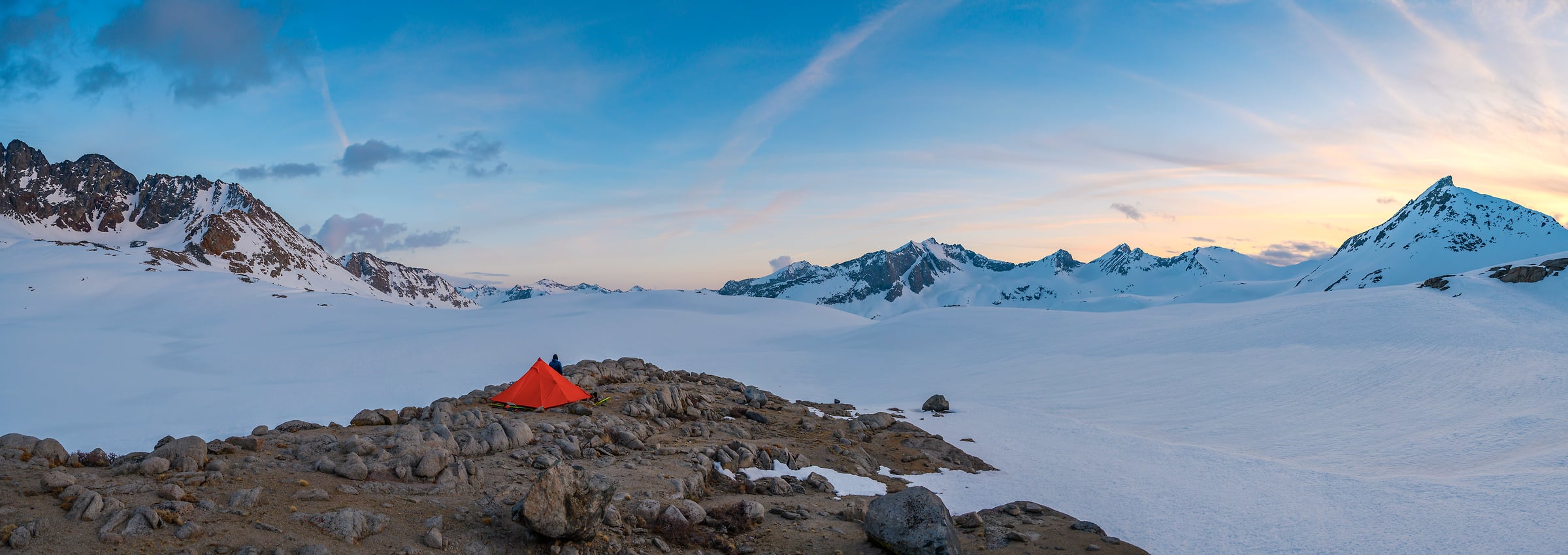 197 megapixels! A very high resolution, panorama photo of a red tent amid snowy mountains at sunset; camping photograph created by Scott Rinckenberger in the Upper Basin, Kings Canyon National Park, California.