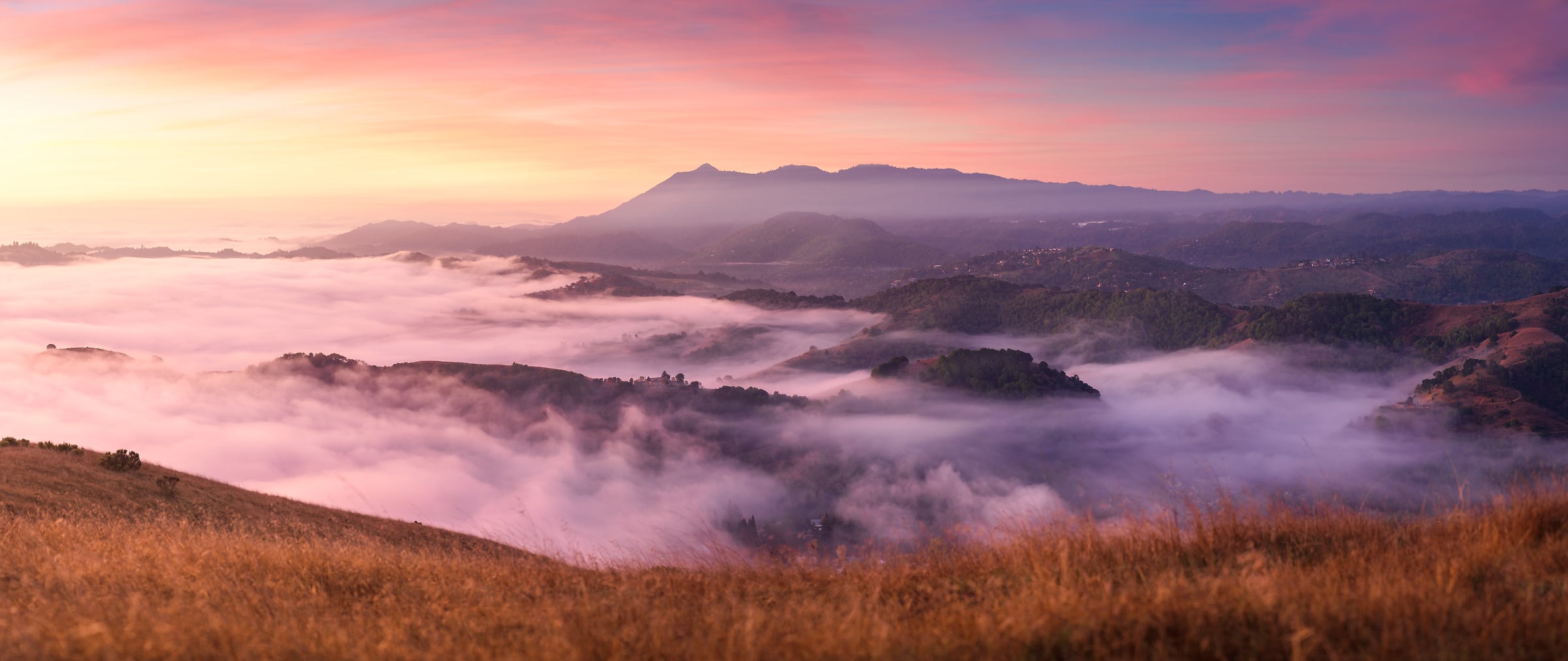 180 megapixels! A very high resolution, large-format VAST photo print of a mountain landscape with fog in the valleys at sunset with a pastel-colored sky; landscape photograph created by Jeff Lewis in Marin County, California.