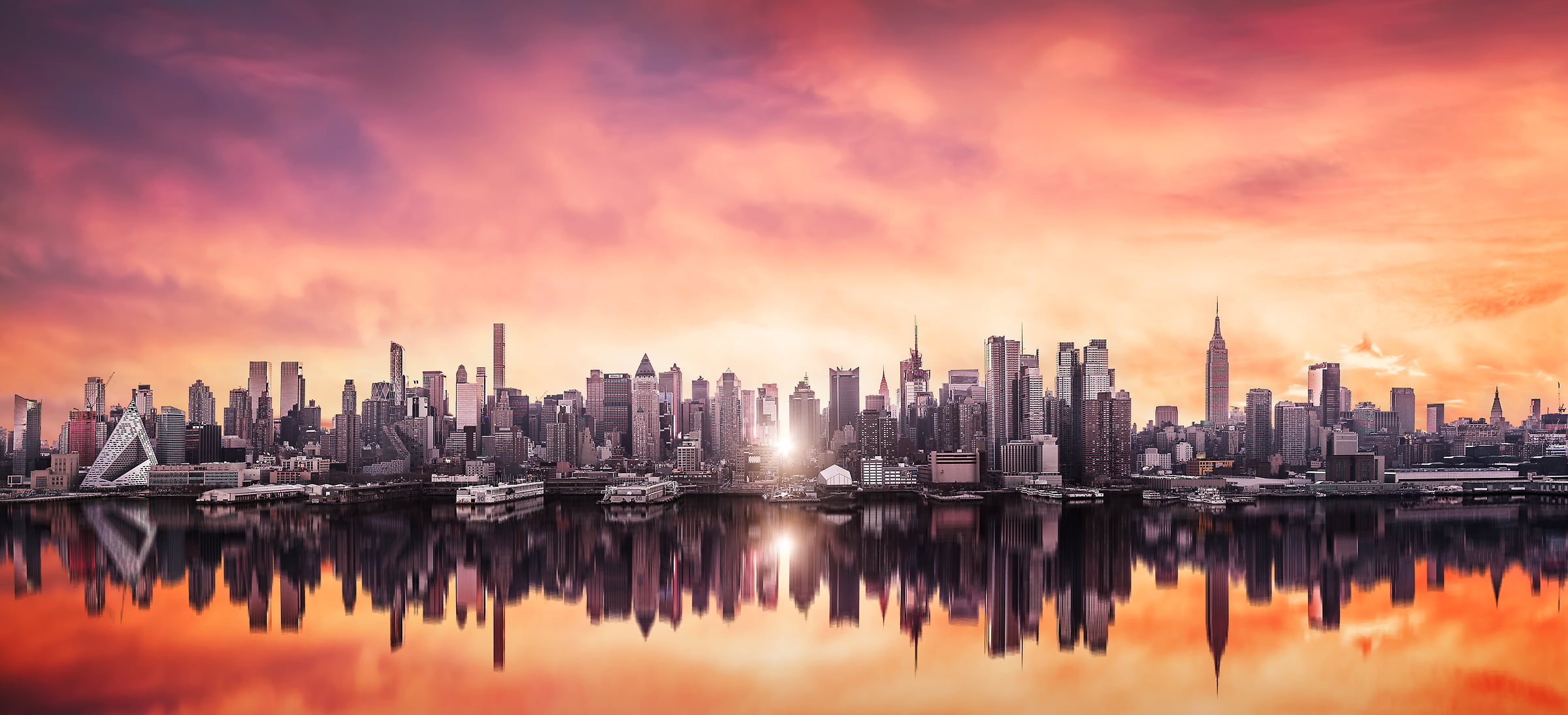 672 megapixels! A very high definition cityscape VAST photo of Manhattanhenge sunrise among the Midtown Manhattan city skyline skyscrapers; created in New York City by Dan Piech