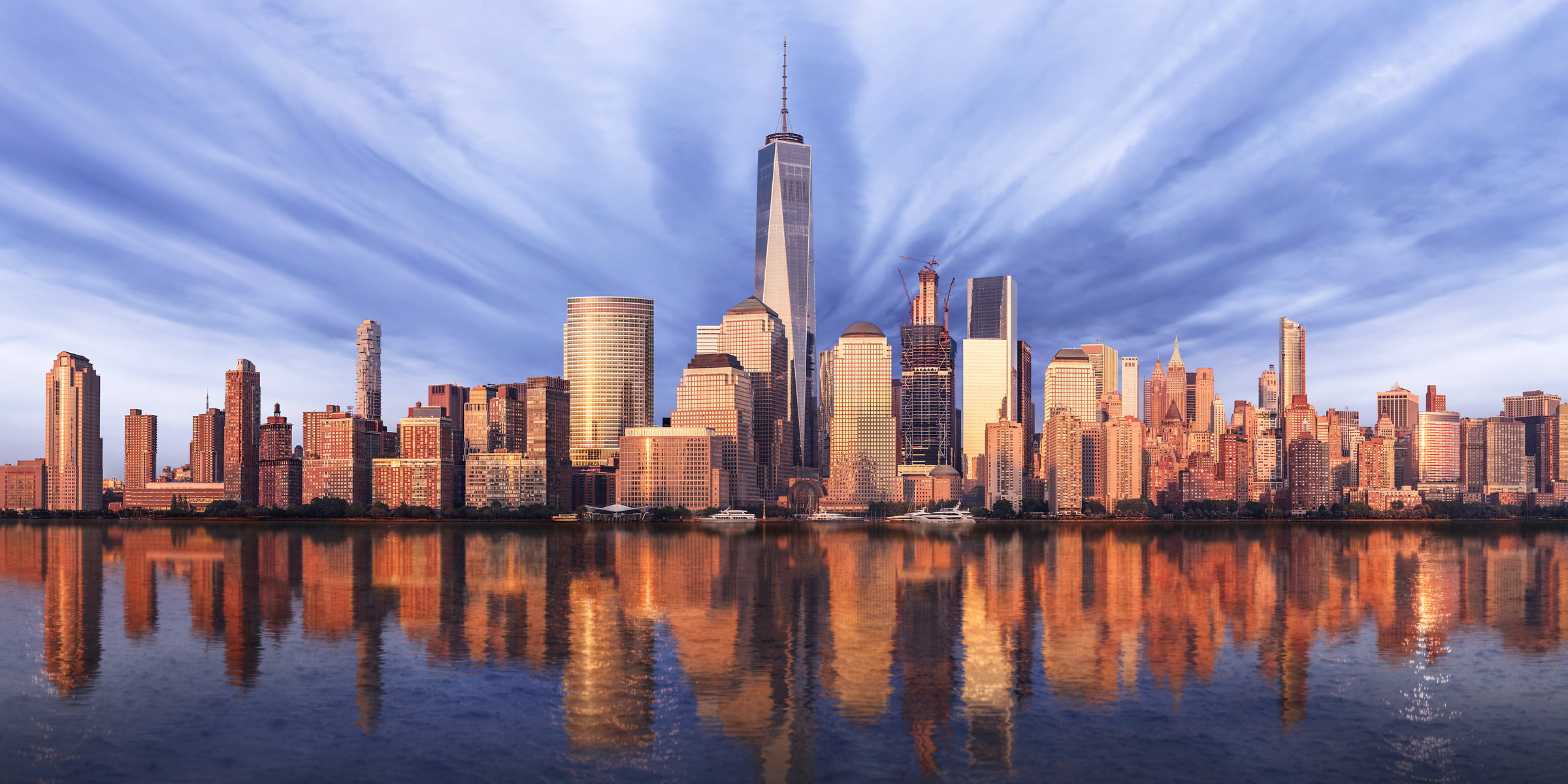 1,349 megapixels! A very high definition cityscape VAST photo of the Financial District, Battery Park City, and the World Trade Center reflecting in the Hudson River at sunset in New York City; created by Dan Piech.