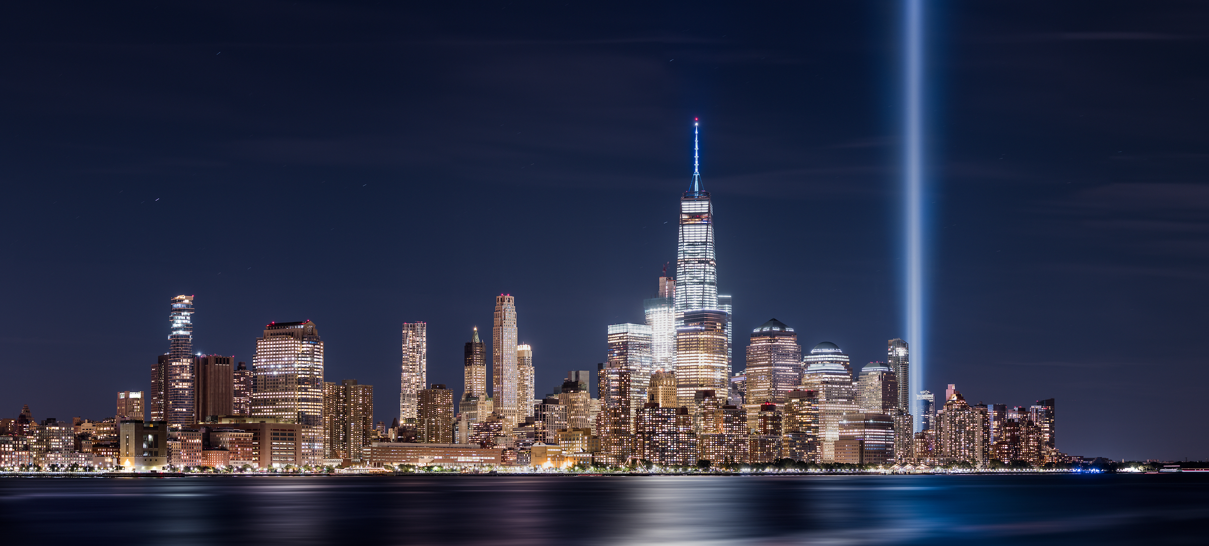 173 megapixels! A very high definition VAST photo of the September 11th 9/11 Tribute in Light memorial, the World Trade Center, and the Manhattan city skyline in New York City; created by Dan Piech.