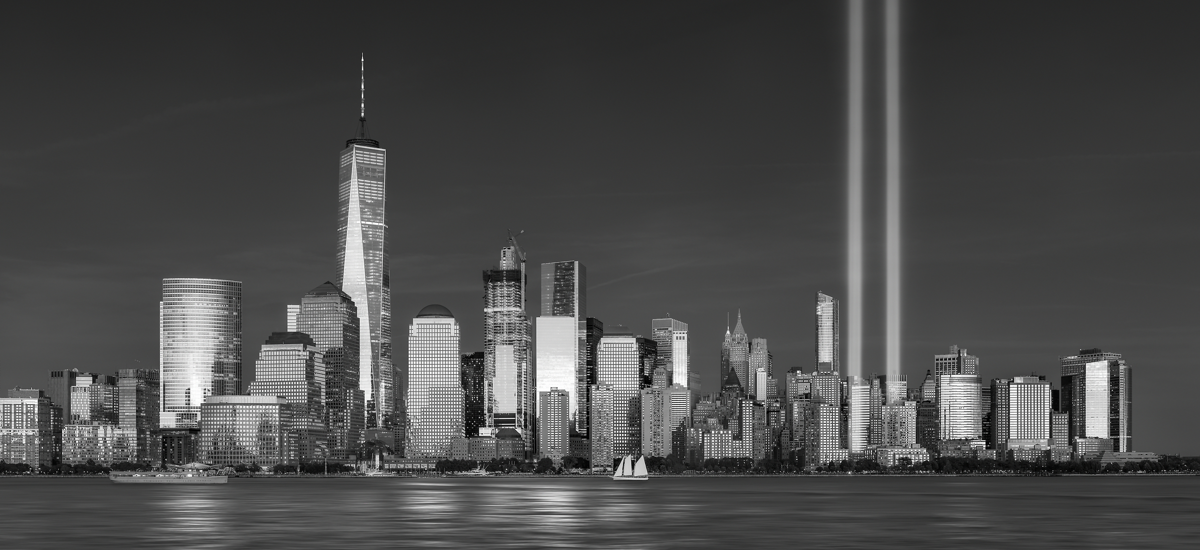 407 megapixels! The highest resolution VAST photo of the September 11th 9/11 Tribute in Light memorial, the World Trade Center, and the Manhattan city skyline at sunset in New York City; created by Dan Piech