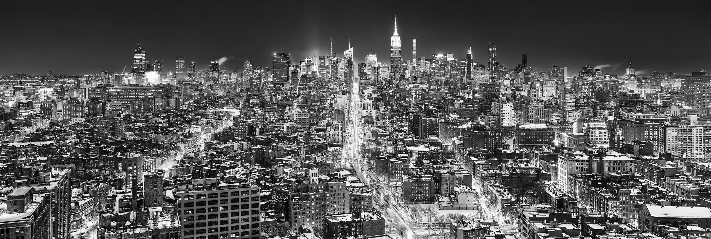 5,910 megapixels! A very high resolution, large-format VAST photo print of the Manhattan NYC skyline in winter snow at night; black and white cityscape fine art photo created by Dan Piech in New York City.