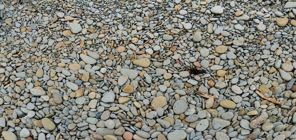 A very high resolution, large-format VAST photo of rocks, stones, and pebbles on a beach; texture photograph created by Scott Dimond in Cape Enrage, New Brunswick, Canada.