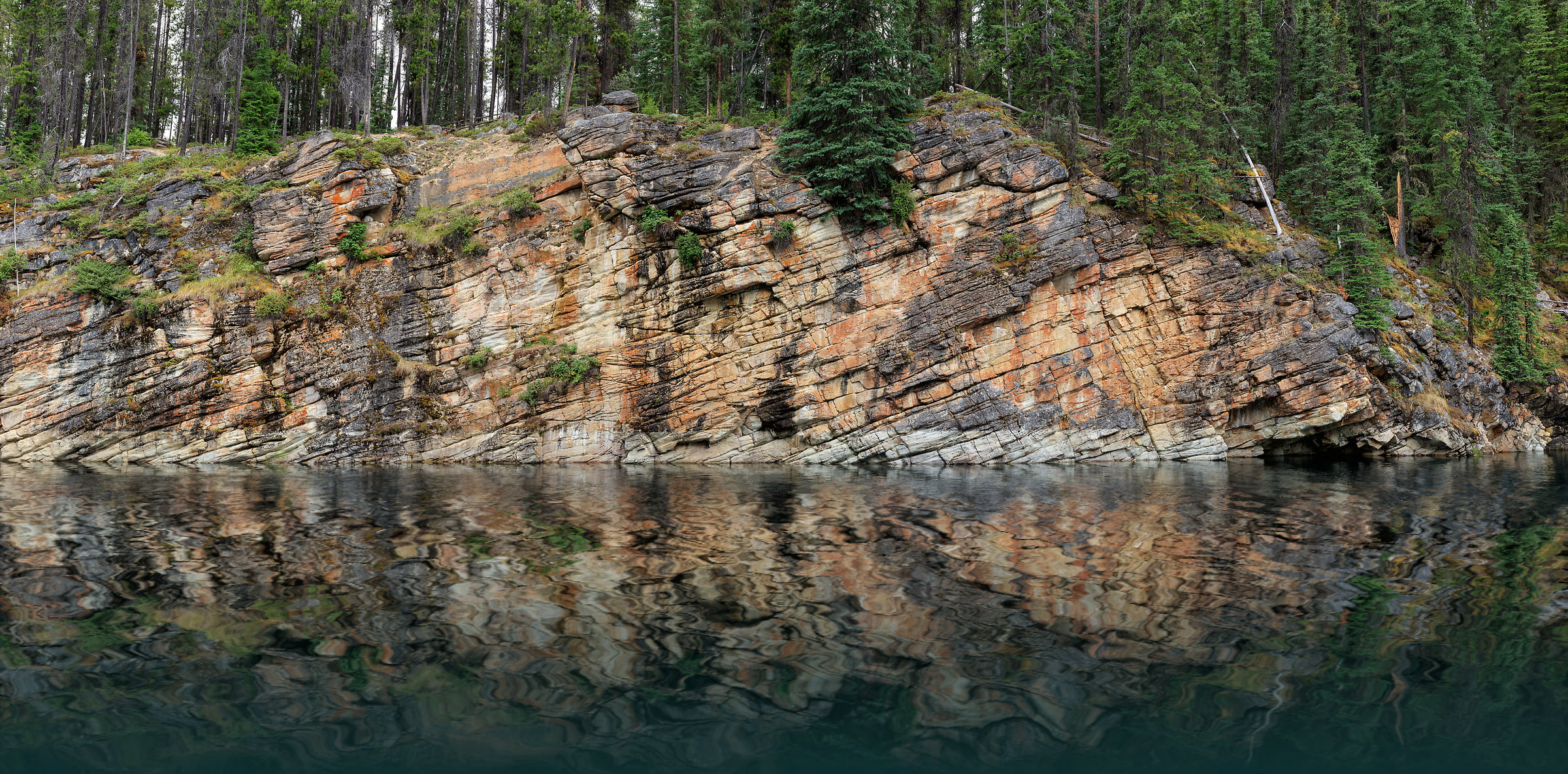 3,135 megapixels! A very high resolution, large-format photo of a rock wall, a calm lake, and an evergreen forest; nature photograph created by Scott Dimond at Horseshoe Lake in Jasper National Park, Alberta, Canada.