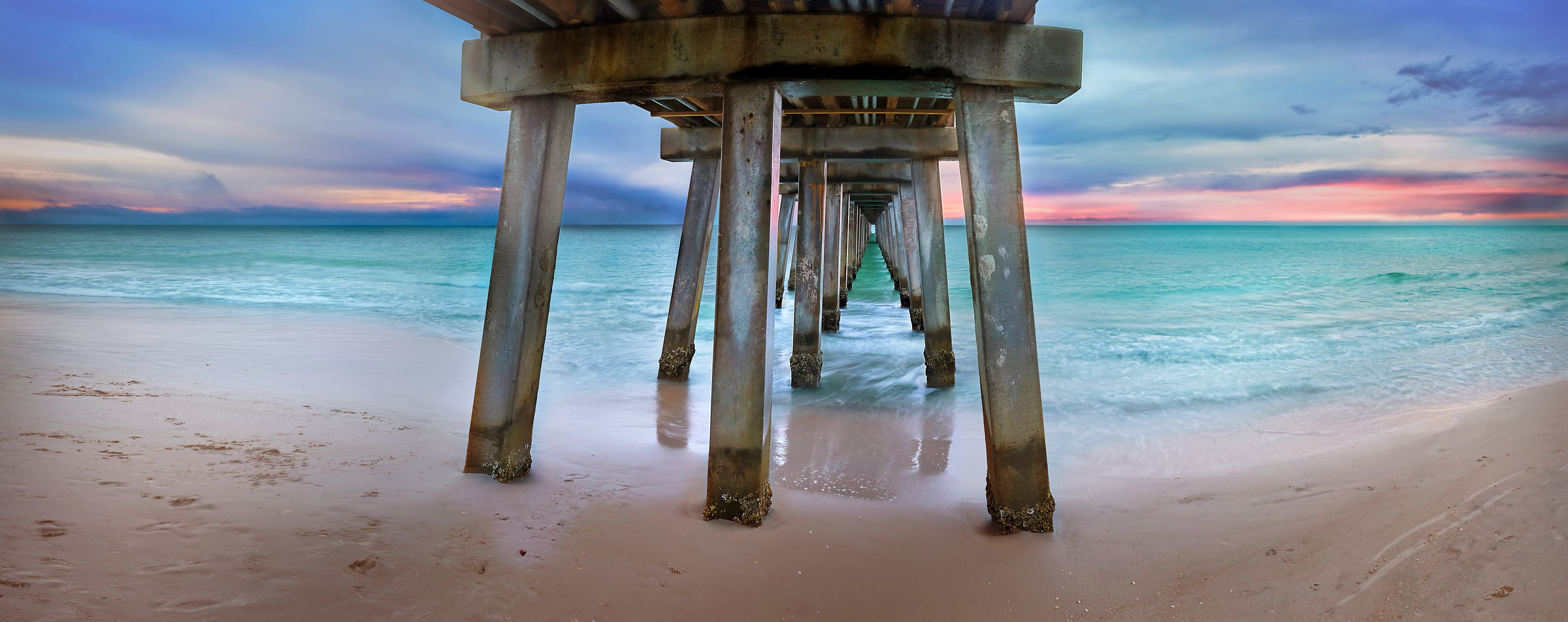 216 megapixels! A very high resolution photo of the beach and ocean under a pier; VAST photo created by Phil Crawshay in Naples Pier, Florida, USA