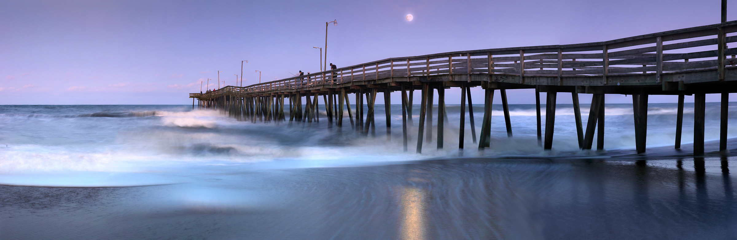 293 megapixels! A very high resolution, large-format VAST photo print of a pier on the beach at dusk with the moon in the background; photograph created by Phil Crawshay in Virginia Beach Pier, Virginia
