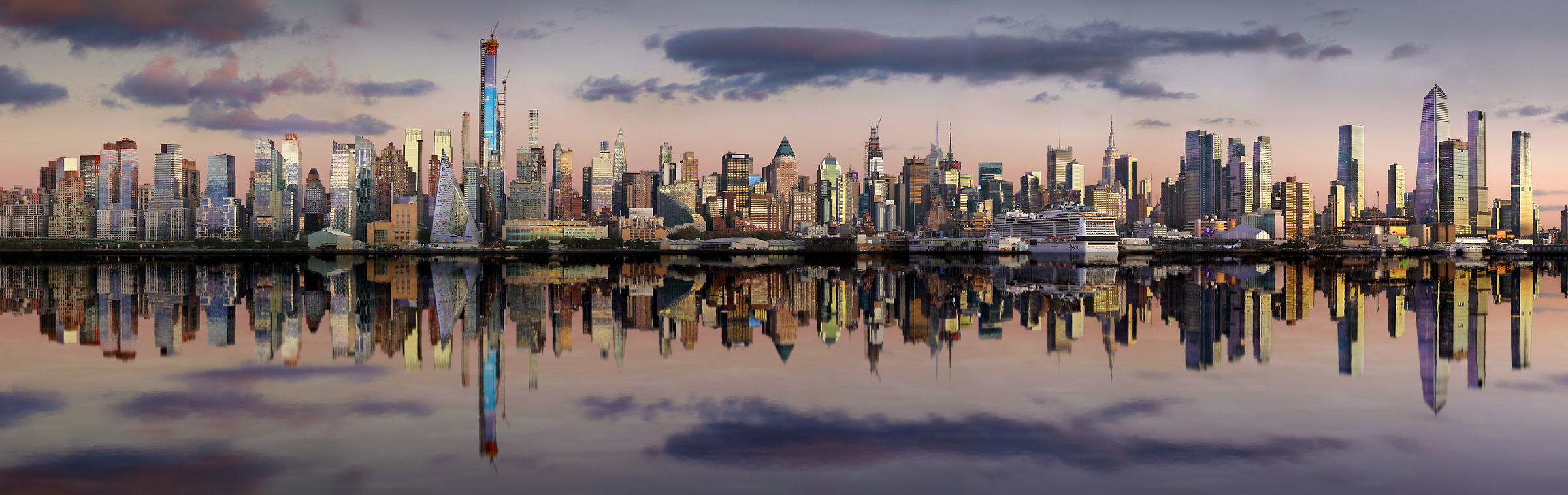 922 megapixels! A very high resolution, large-format VAST photo print of the New York skyline at sunset reflecting in the Hudson River; panorama photograph created by Phil Crawshay in New York, Manhattan.