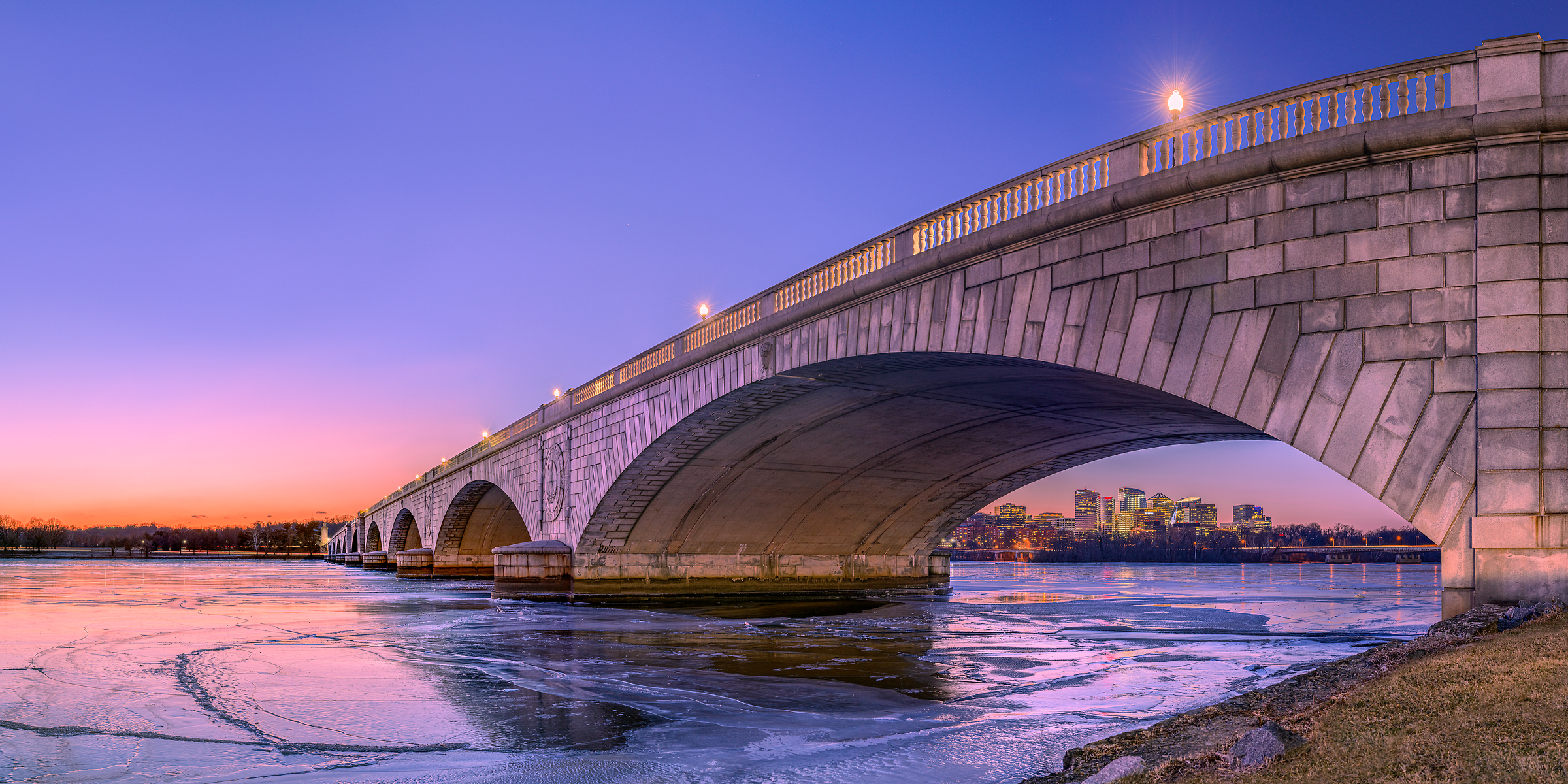 223 megapixels! A very high resolution, large-format VAST photo print of Arlington Memorial Bridge at sunset with the Potomac River frozen; photograph created by Tim Lo Monaco in Arlington Memorial Bridge, Potomac River, Washington, D.C.