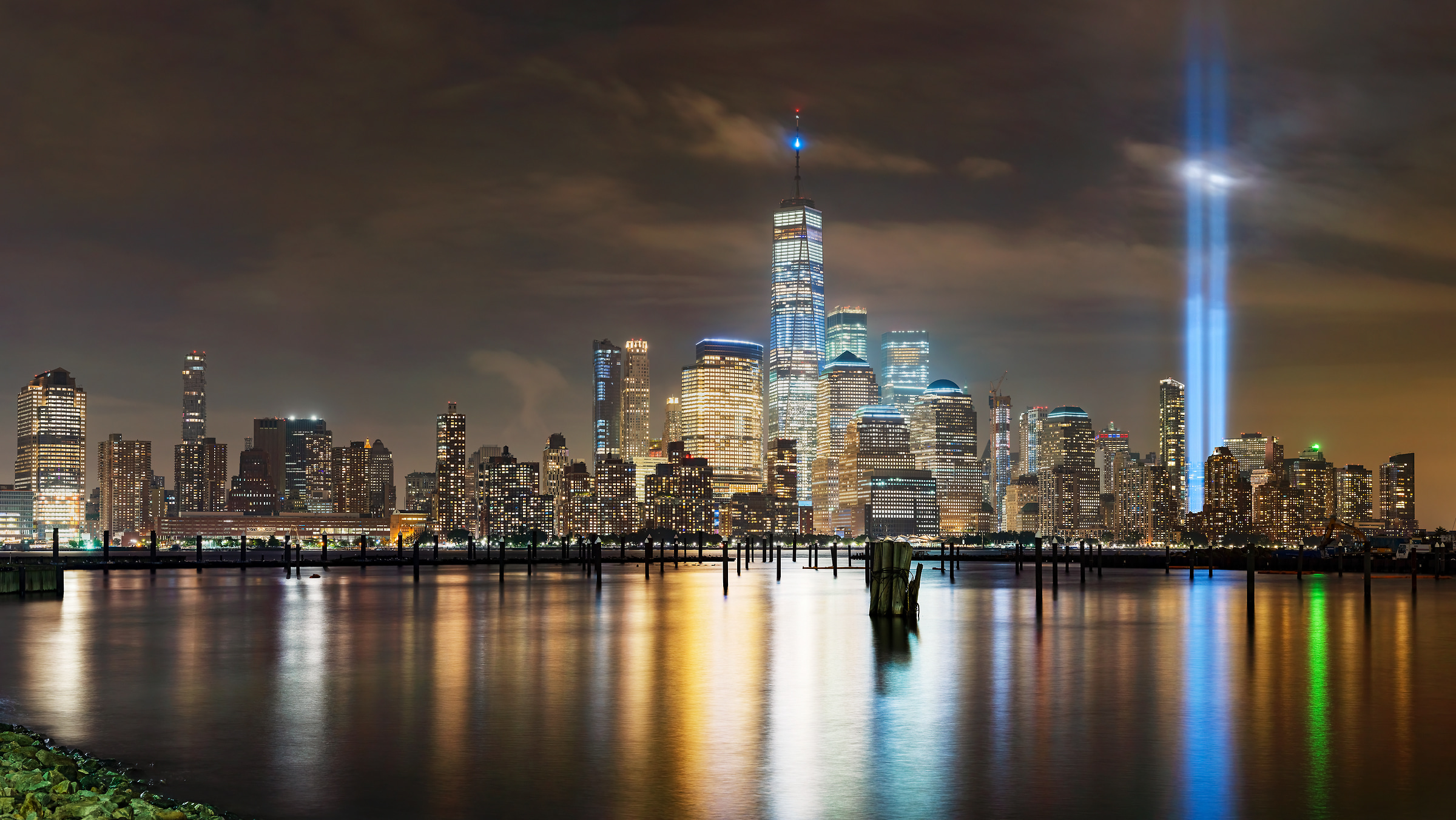 367 megapixels! A very high resolution, large-format VAST photo print of the 9/11 Tribute in Light memorial and the downtown Manhattan skyline at night; cityscape photograph created by Beyti Barbaros in Downtown Manhattan, New York City, New York.