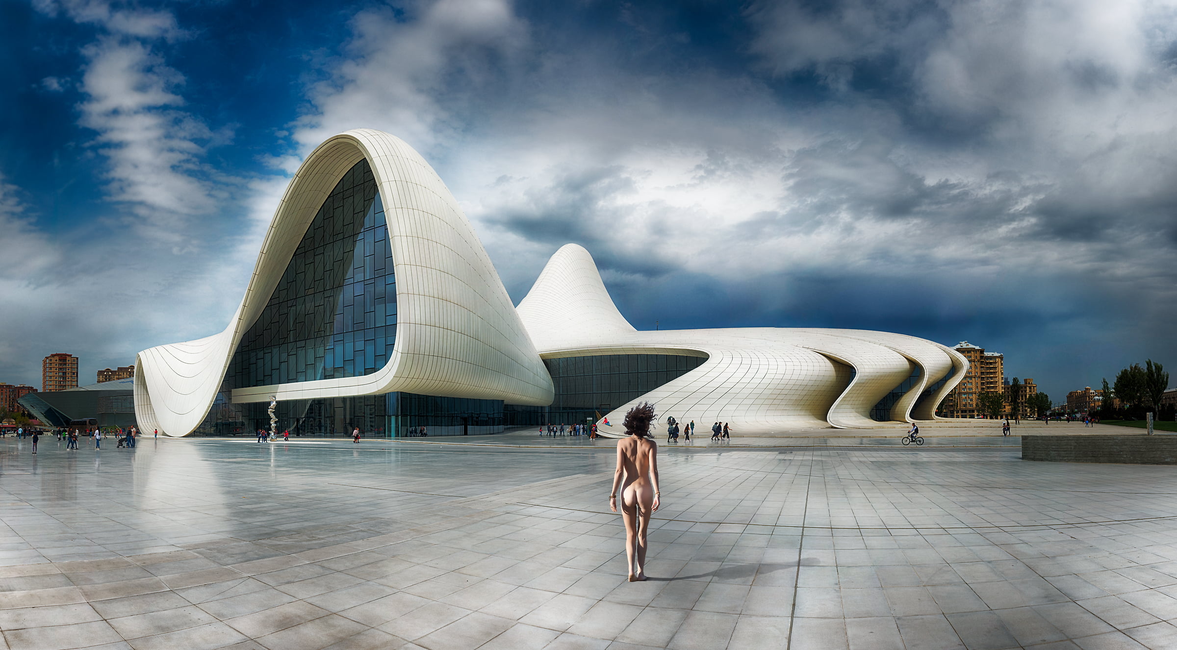 159 megapixels! A very high resolution, large-format VAST photo print of a nude woman in a plaza in front of a modern building; surreal nude photograph created by Peter Rodger in Heydar Aliyev Center, Baku, Azerbaijan.