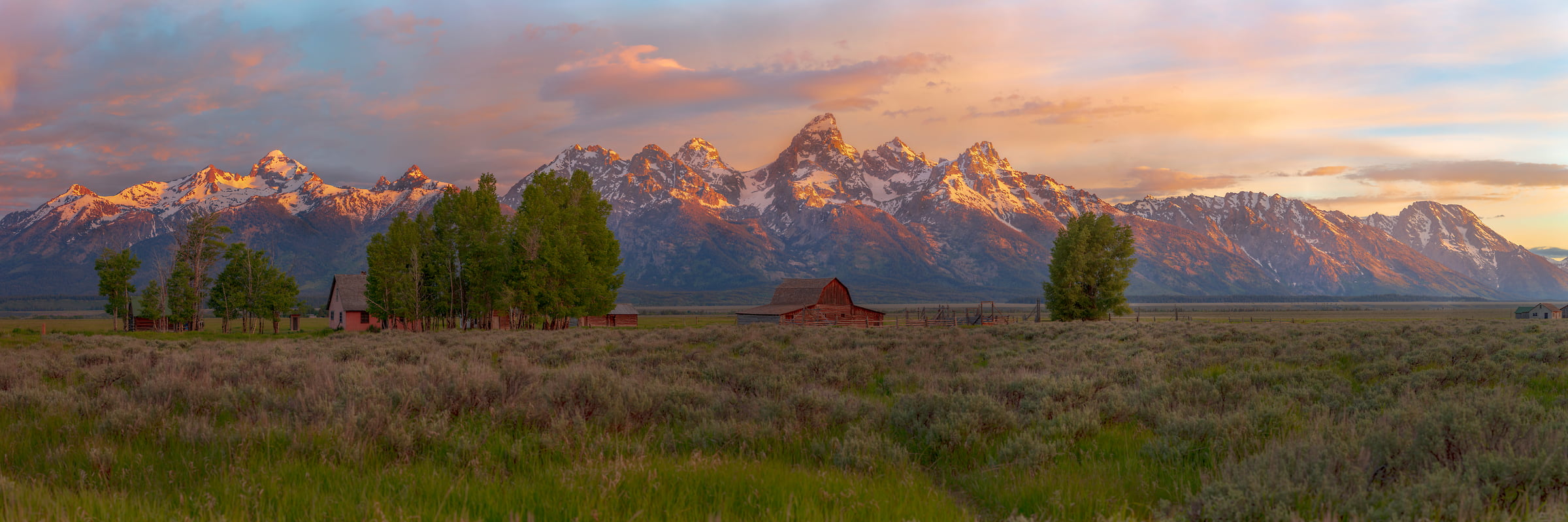 302 megapixels! A very high resolution, large-format VAST photo print of mountains, a field, and a barn in Wyoming; landscape photograph created by John Freeman.