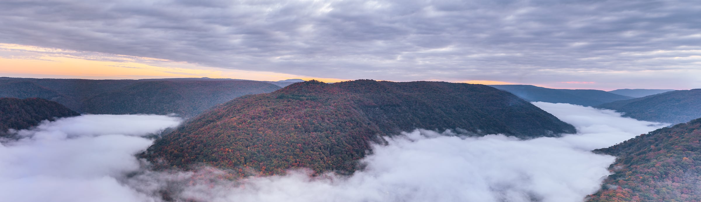 570 megapixels! A very high resolution, large-format VAST photo print of the mountains of New River Gorge National Park at sunrise with fog and autumn foliage; landscape photograph created by Chris Blake in New River Gorge National Park & Preserve, West Virginia.
