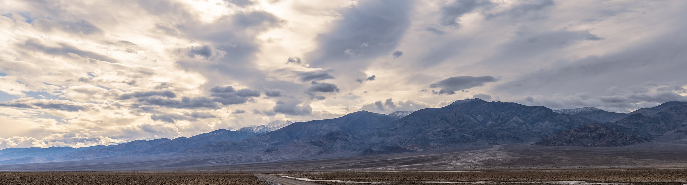 614 megapixels! A very high resolution, large-format VAST photo print of West Road in Death Valley with epic clouds; landscape photograph created by Chris Blake in Death Valley National Park, California.