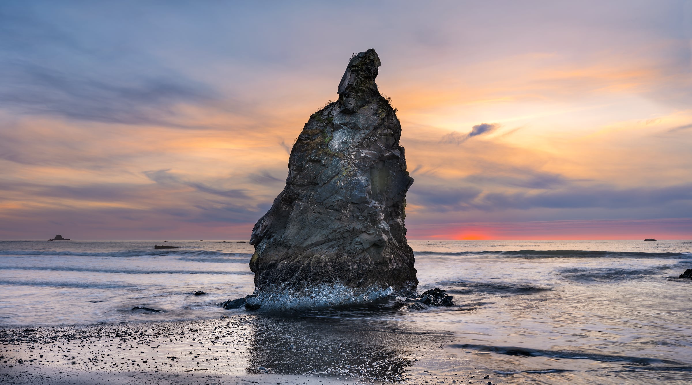 440 megapixels! A very high resolution, large-format VAST photo print of a large rock formation on the beach in the surf of the Pacific Ocean at sunset; photograph created by Chris Blake in Olympic National Park, Washington.