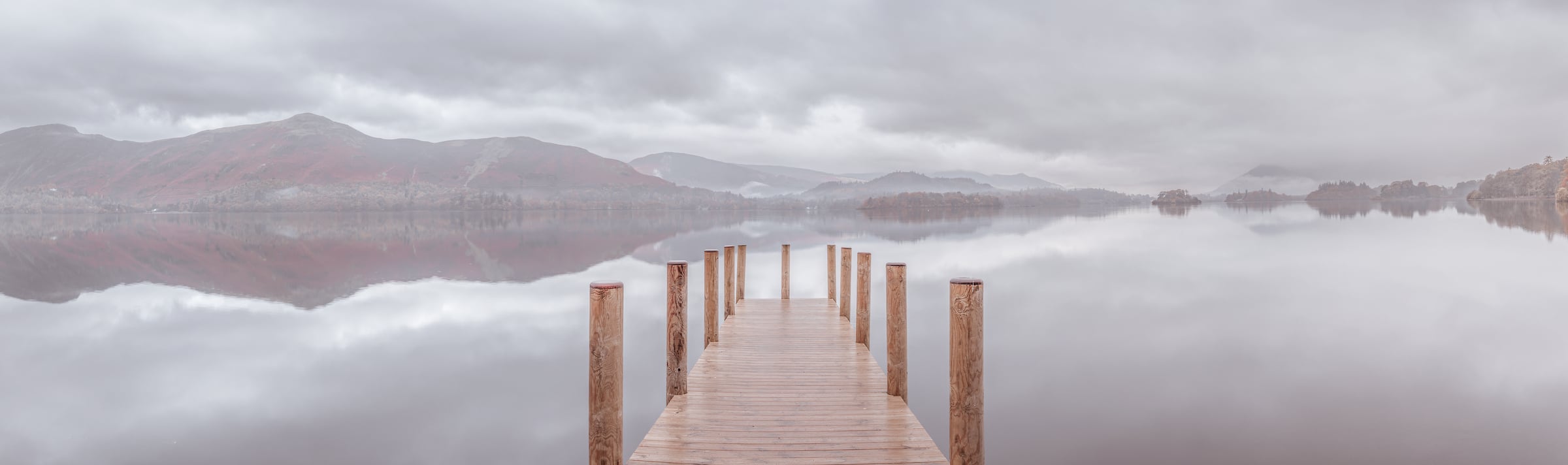 204 megapixels! A very high resolution, large-format VAST photo print of a peaceful water scene with a wood pier going into a calm lake with mountains in the background; panorama photograph created by Assaf Frank in Derwentwater pier, Lake District National Park, Cumbria, United Kingdom.
