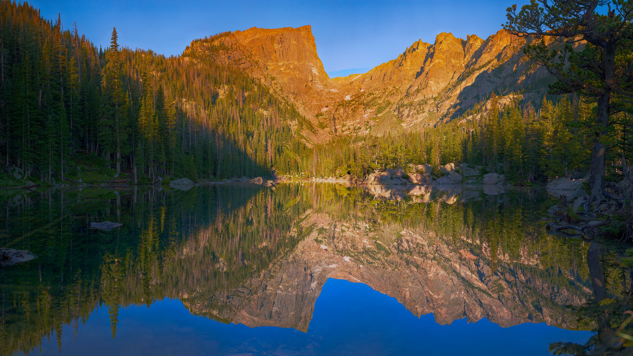 6,262 megapixels! A very high resolution, large-format wallpaper photo of a peaceful lake with mountains and pine trees; landscape photograph created by John Freeman at Dream Lake in Rocky Mountain National Park, Colorado.