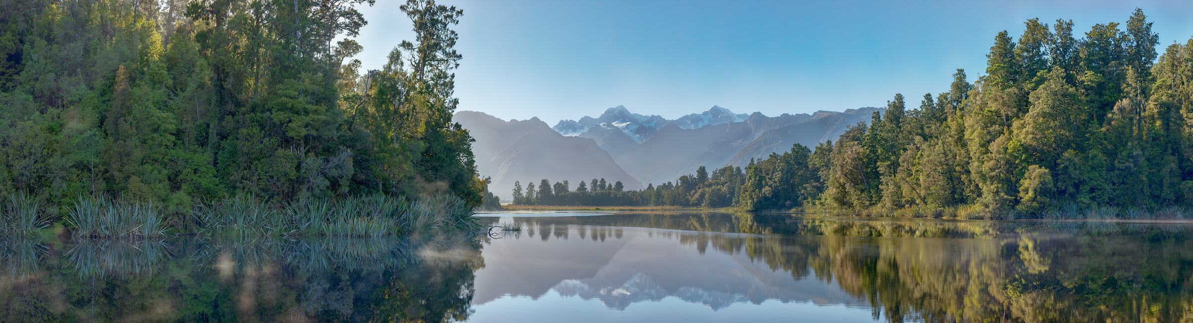 506 megapixels! A very high resolution, large-format VAST photo print of a lake in front of a mountain range; landscape photograph created by John Freeman in Lake Matheson, South Island, New Zealand.