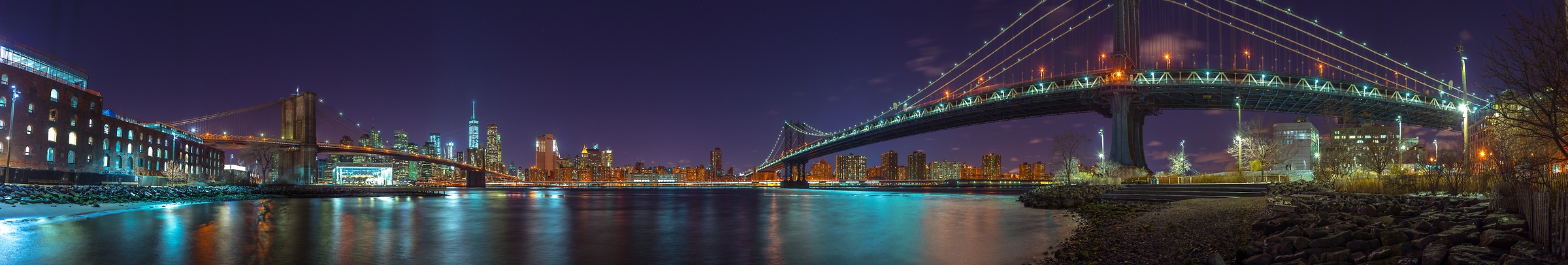 364 megapixels! A very high resolution, large-format VAST photo print of the Manhattan Bridge and the Brooklyn Bridge with the Manhattan skyline in the background at night; panorama photograph created by Assaf Frank in New York, New York.