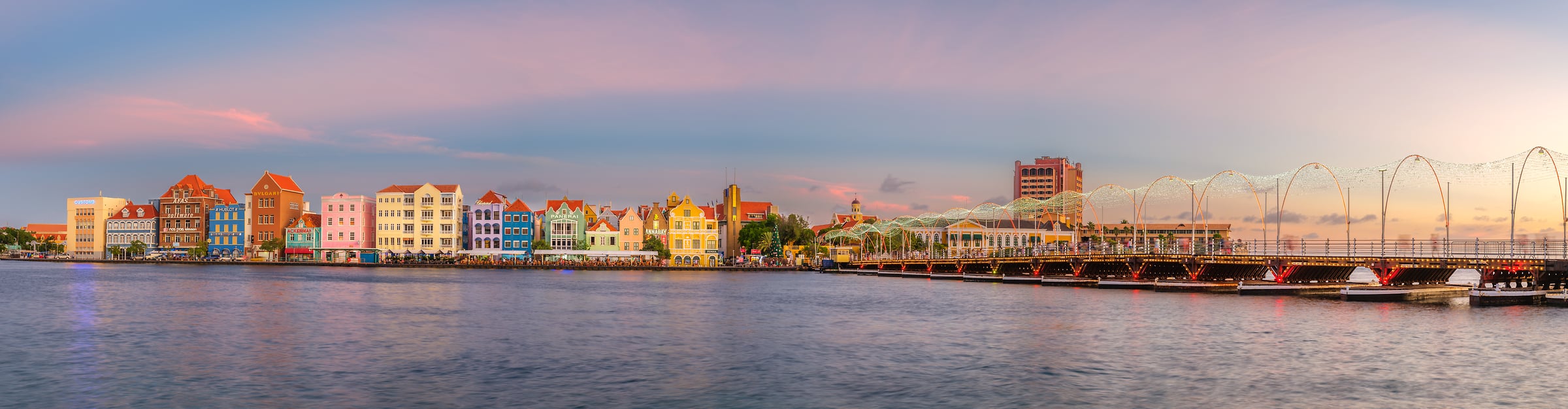 292 megapixels! A very high resolution, large-format VAST photo print of the waterfront in Curacao at sunset with beautiful multi-colored buildings; photograph created by Assaf Frank in De Rouvilleweg, Willemstad, Curacao.