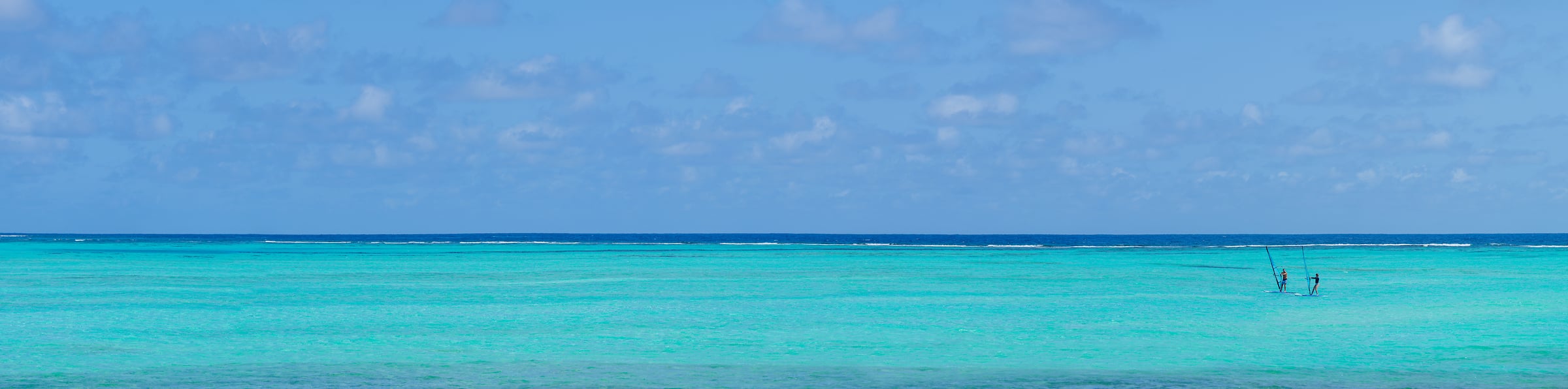 308 megapixels! A very high resolution, large-format VAST photo print of an idyllic seascape with two windsurfers on the turquoise ocean water; photograph created by Assaf Frank in Kralendijk, Bonaire, Caribbean Netherlands.