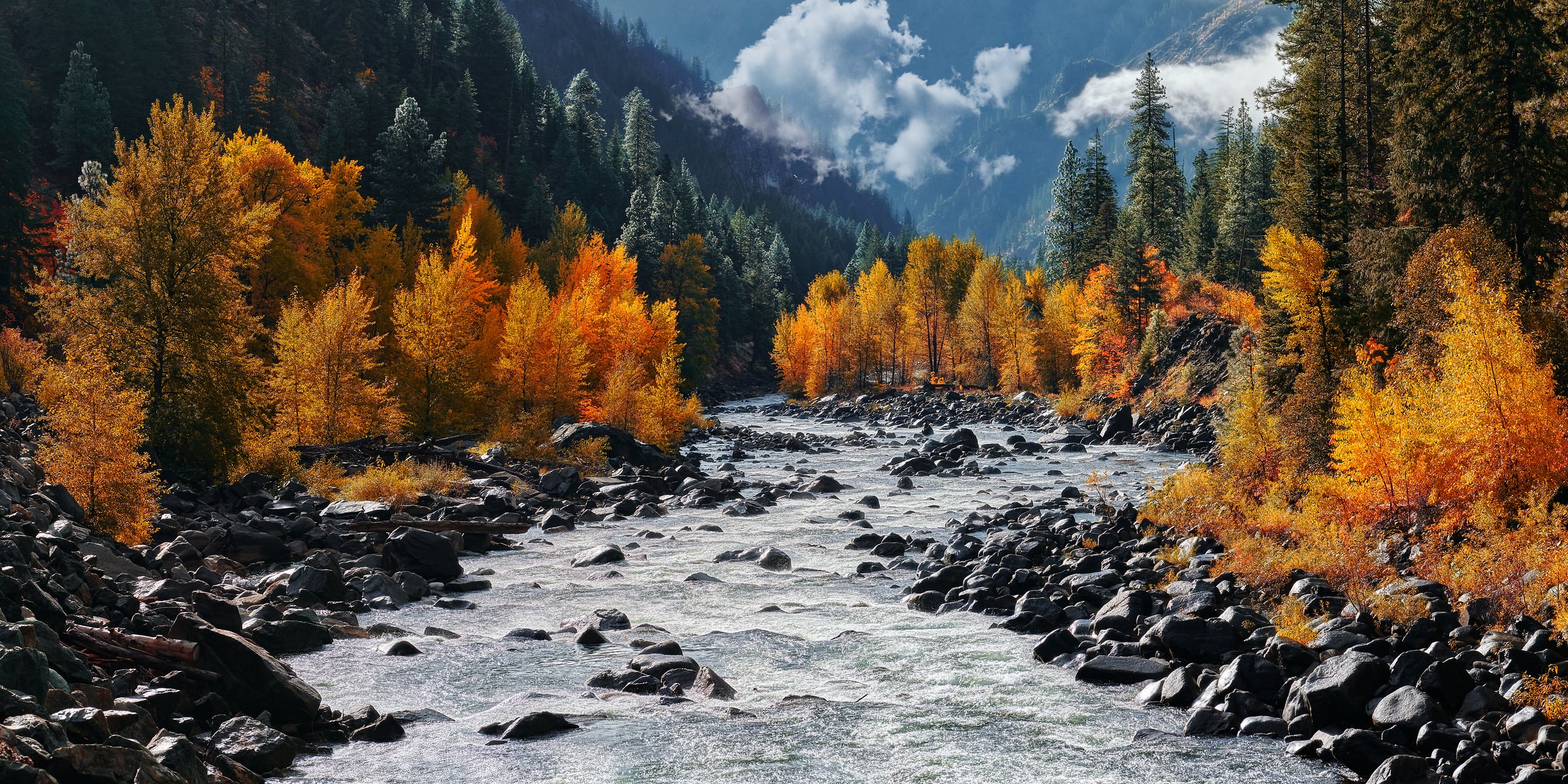 212 megapixels! A very high resolution, large-format VAST photo print of a beautiful mountain river with autumn trees on either side and colorful orange and yellow foliage; fine art nature photograph created by Chris Collacott.