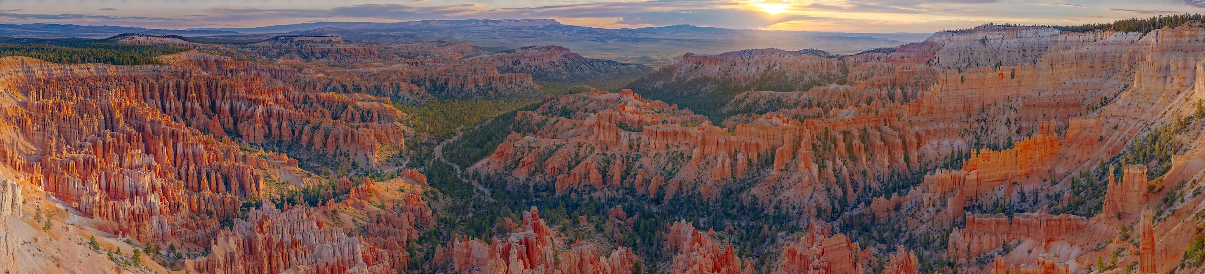 4,953 megapixels! A gigapixel panorama photo of a beautiful landscape with a canyon, valley, and hoodoos at sunset; photograph created by John Freeman from Inspiration Point at Bryce Canyon National Park in Utah.