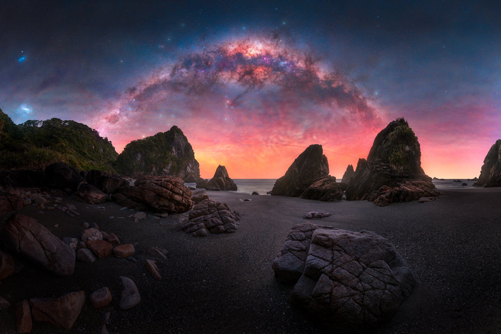 195 megapixels! A very high resolution, large-format VAST photo print of the night sky and the Milky Way over a beach with large rock formations; photograph created by Paul Wilson in West Coast.