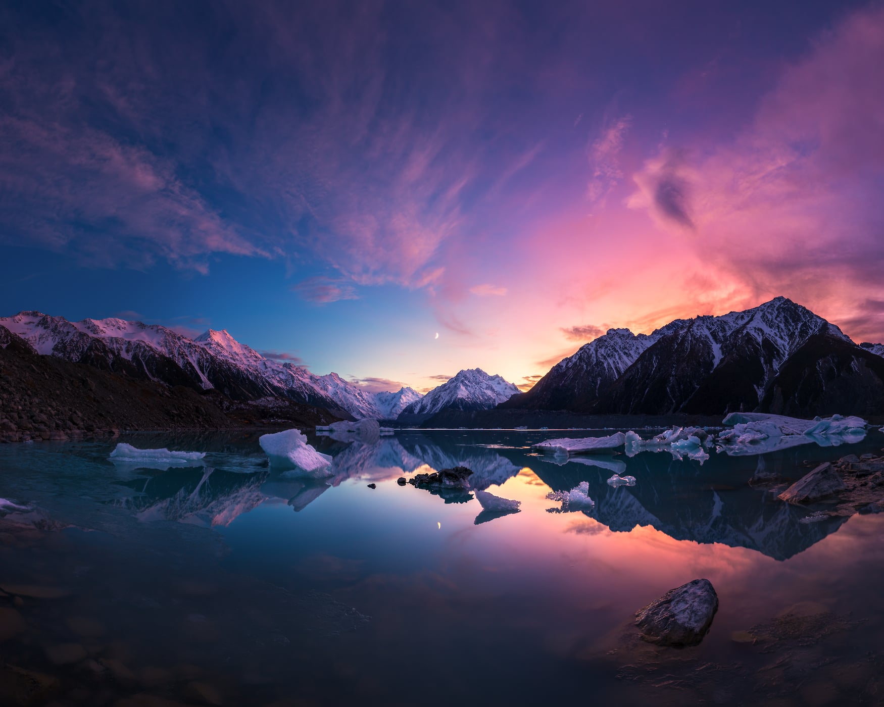 313 megapixels! A very high resolution, large-format VAST photo print of a mountain landscape at sunrise with a beautiful blue, pink, and purple sky, snow-covered mountains, and a lake in the foreground; landscape photograph created by Paul Wilson at Tasman Lake in Mount Cook National Park, New Zealand.