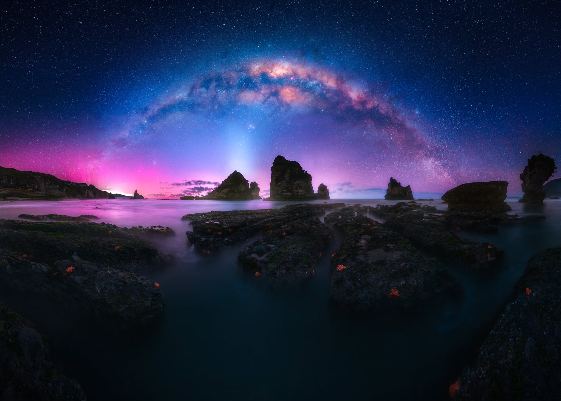 521 megapixels! A very high resolution, large-format VAST photo print of a beach at night with the Milky Way in the sky and rocks on the shore; fine art photograph created by Paul Wilson at Motukiekie Beach in West Coast, New Zealand.