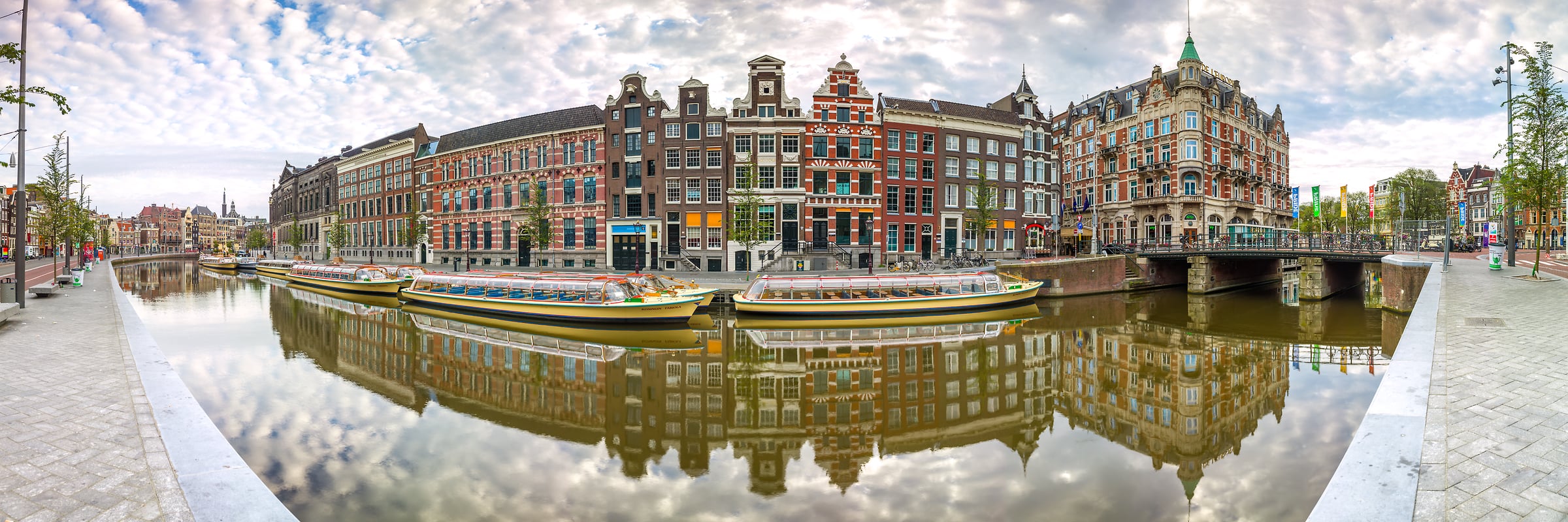 200 megapixels! A very high resolution, panorama photo of a canal in Amsterdam with colorful buildings, boats, and bridges; photograph created by Assaf Frank in the Netherlands.