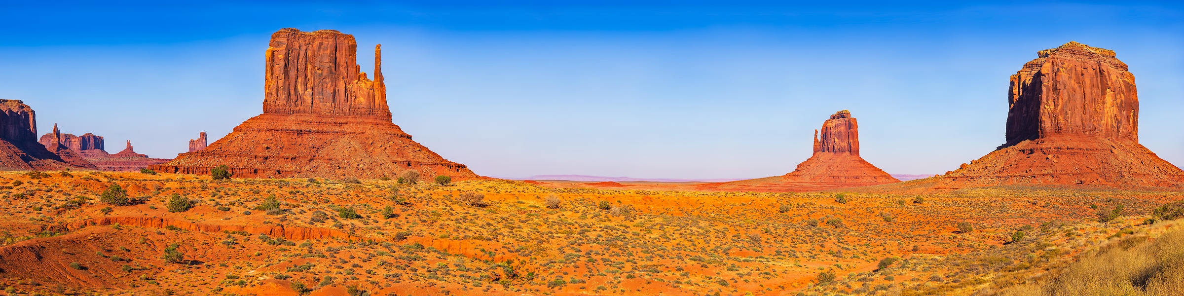 3,221 megapixels! A very high resolution, panorama photo of large rock formations the desert in Monument Valley; landscape photograph created by John Freeman from The Mittens & Merrick Butte Viewpoint in Monument Valley, Arizona.