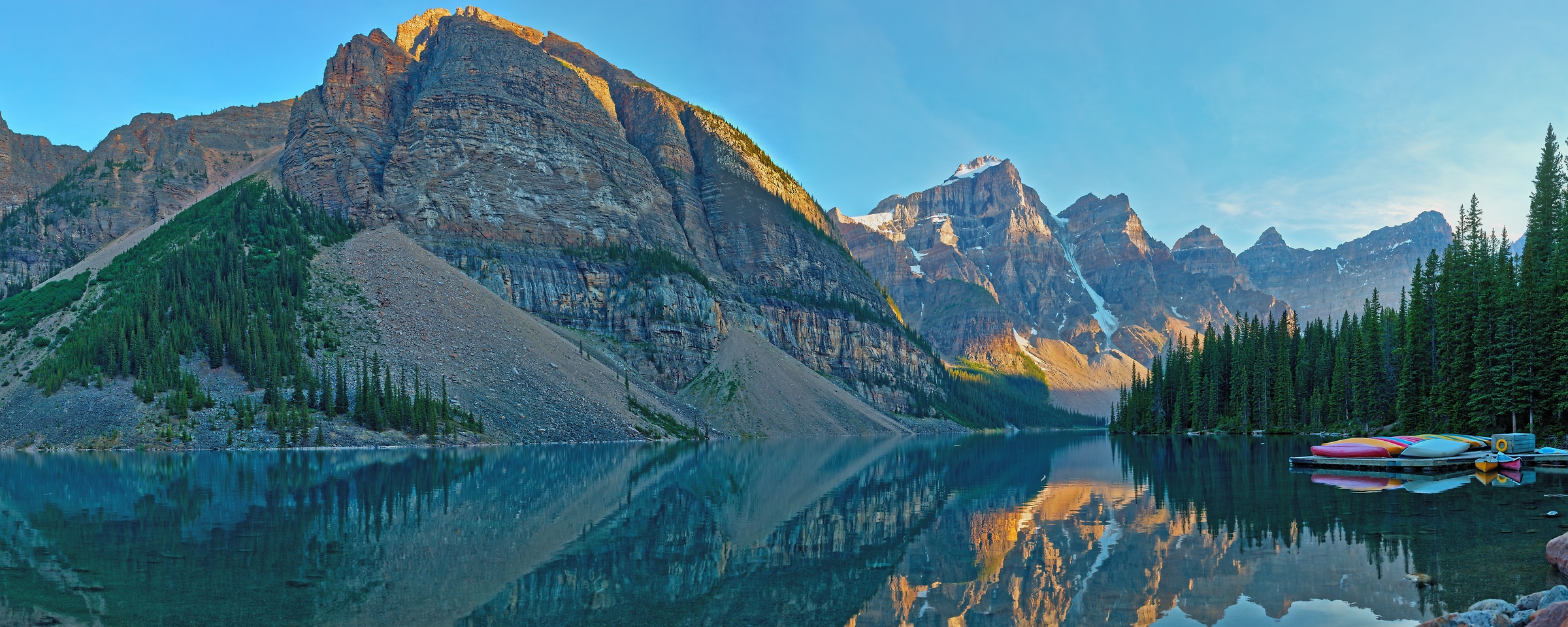 587 megapixels! A very high resolution, large-format VAST photo print of a lake with mountains in the background and canoes in the foreground; landscape photograph created by John Freeman at Moraine Lake in Banff National Park, Alberta, Canada.