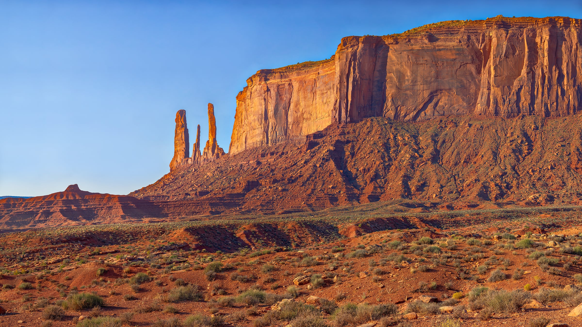 2,121 megapixels! A very high resolution, large-format VAST photo print of the Three Sisters rock formation in Monument Valley, Arizona; landscape photograph created by John Freeman along Seventeen Mile Road.