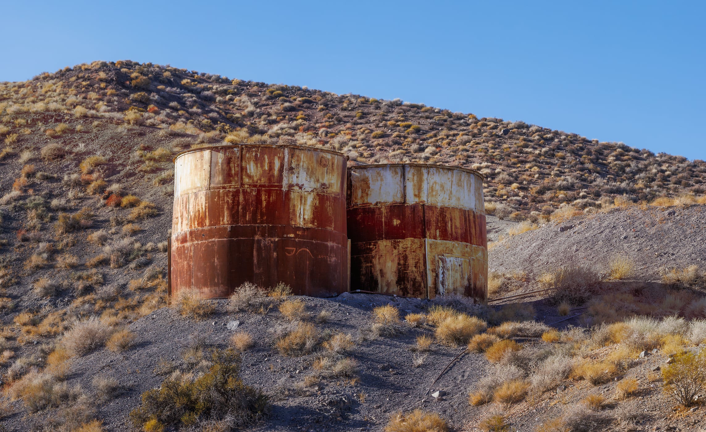 355 megapixels! A very high resolution, large-format VAST photo print of a pair of water tanks on a desert hill; fine art photograph created by Chris Blake in Death Valley National Park, California.