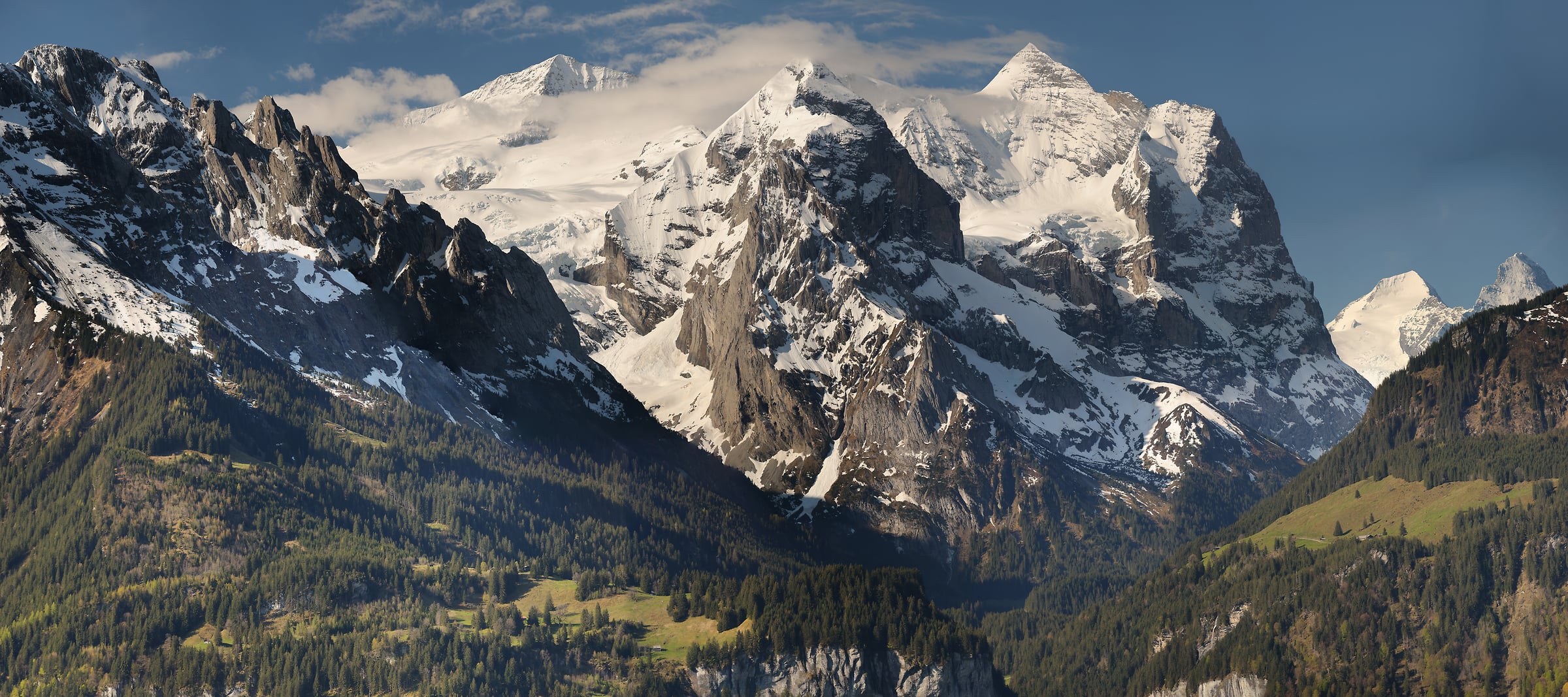 400 megapixels! A very high resolution panorama photo of a beautiful Switzerland landscape with impressive mountains, a valley, and small homes on hillsides; photograph created by Alexandre Deschaumes in Switzerland.