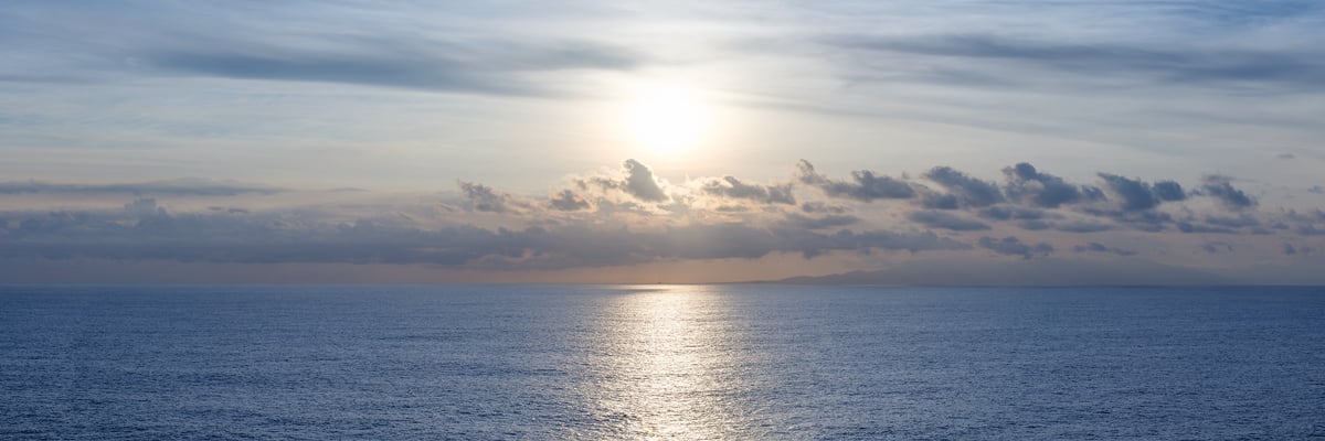 217 megapixels! A very high resolution, large-format fine art photo print of the ocean in the morning with a bright sun rising over some beautiful clouds; sea photograph created by Assaf Frank.