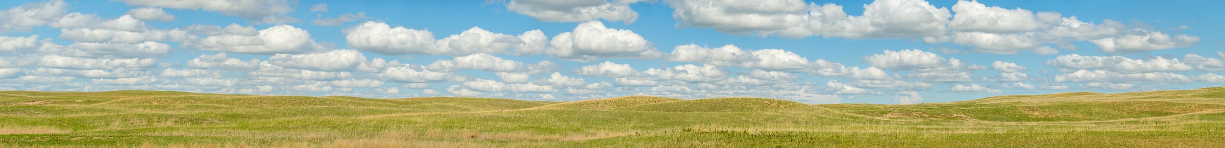 1,103 megapixels! A very high resolution, gigapixel panorama photo of rolling hills of fields under a blue sky spotted with puffy white clouds; landscape photograph created by Jerred Zegelis in Urbandale, Iowa.
